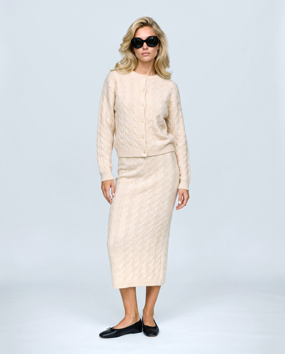 The Cable Knit Top & Skirt Set in Light apricot, front view on a non-pregnant model