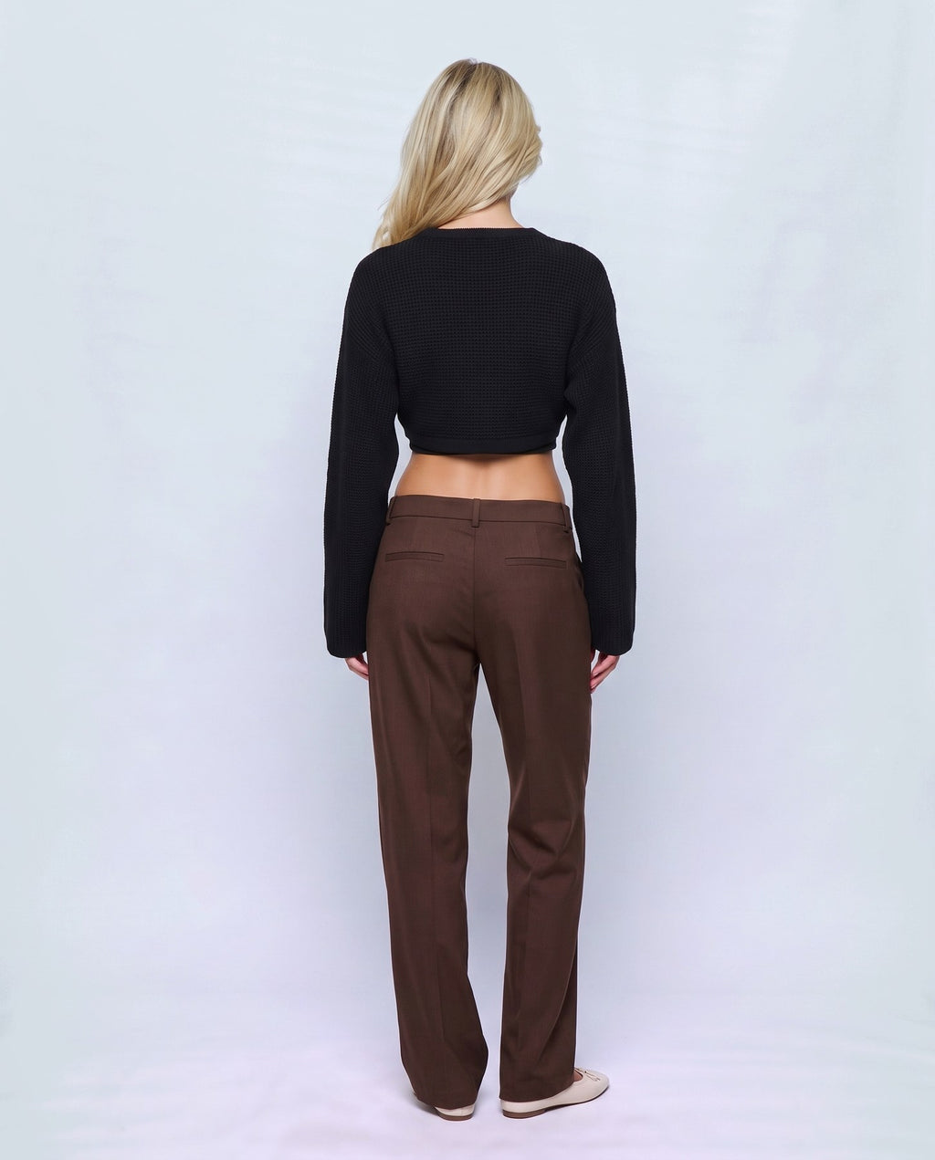Aline Cross-Front Sweater in Black, back view on a non-pregnant model