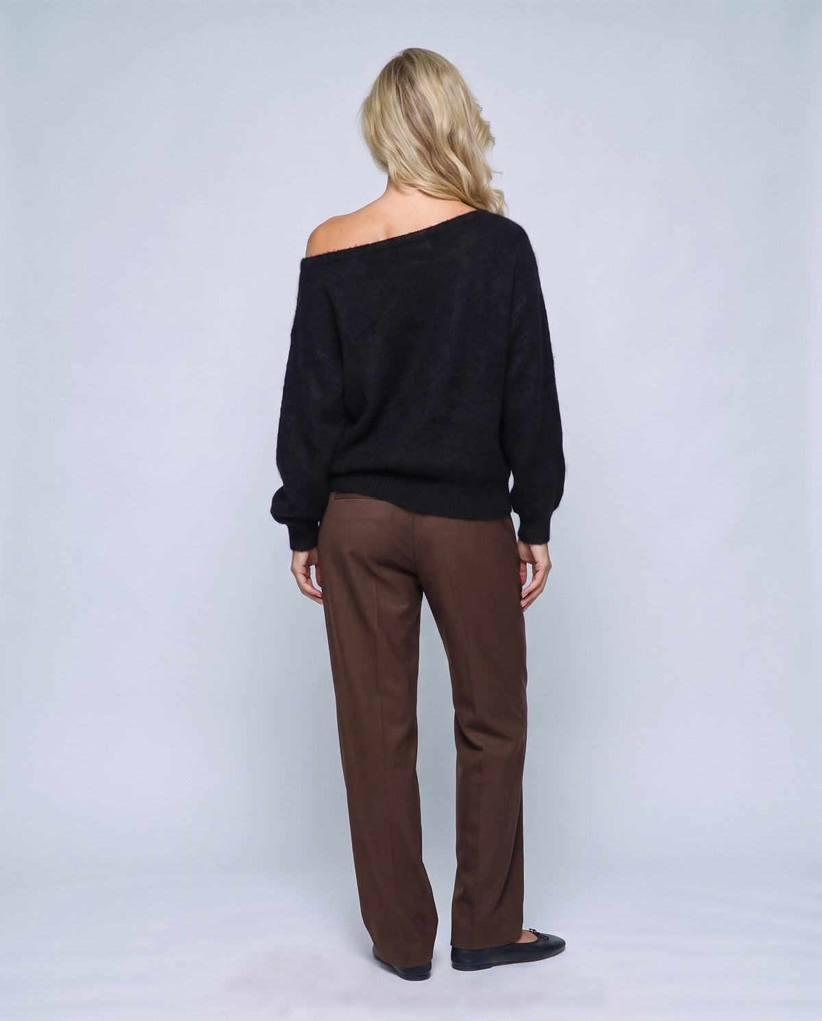 Ines Off-Shoulder Sweater in Black, back view on a non-pregnant model