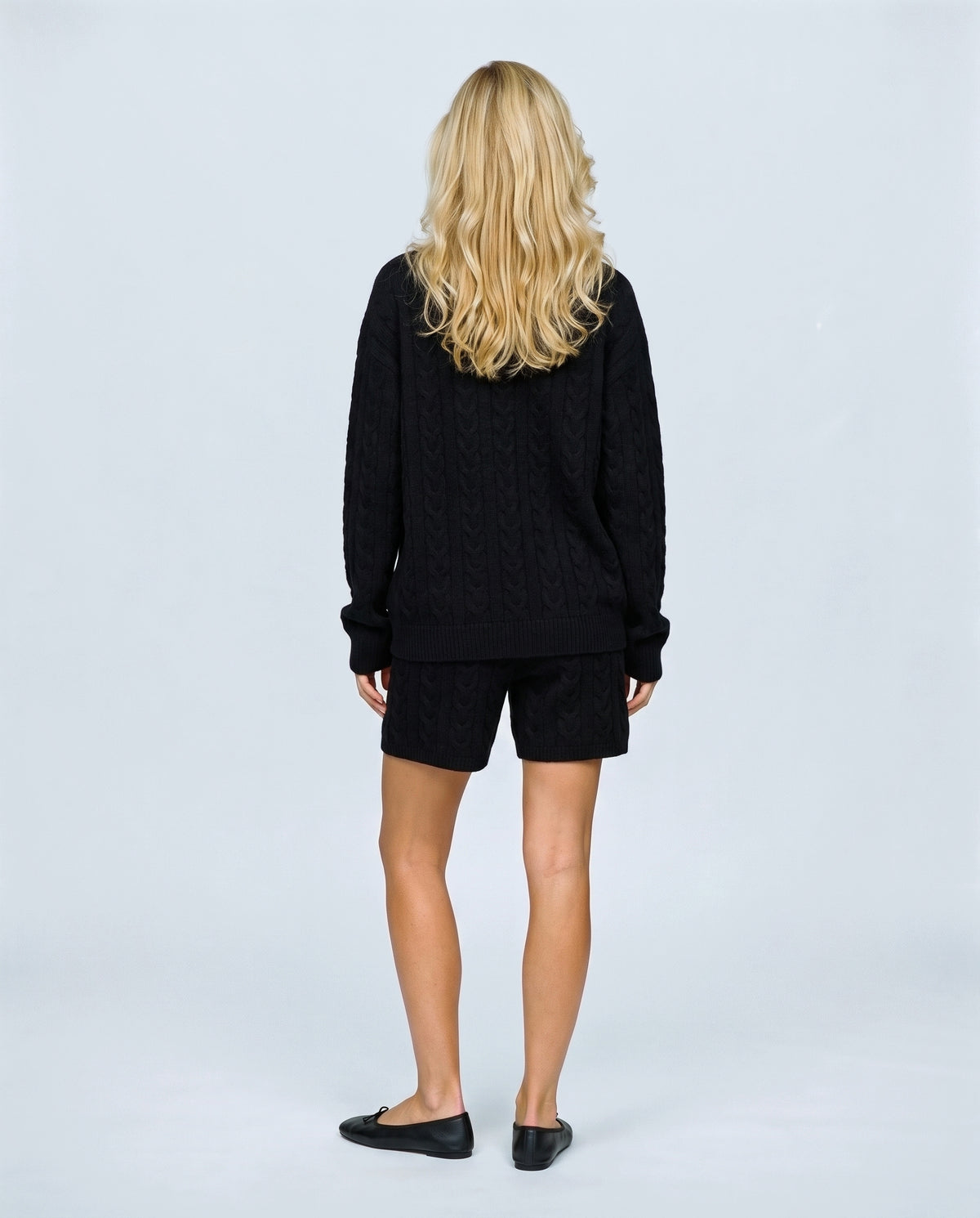 The Cable Knit Shorts Set in Black, back view on a non-pregnant model