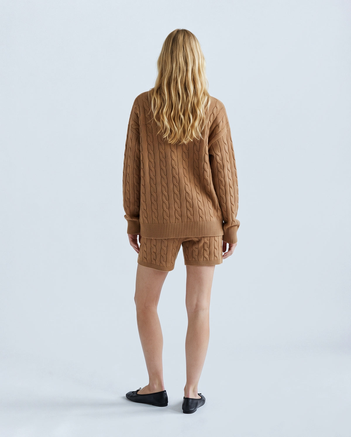 The Cable Knit Shorts Set in Caramel, back view on a non-pregnant model