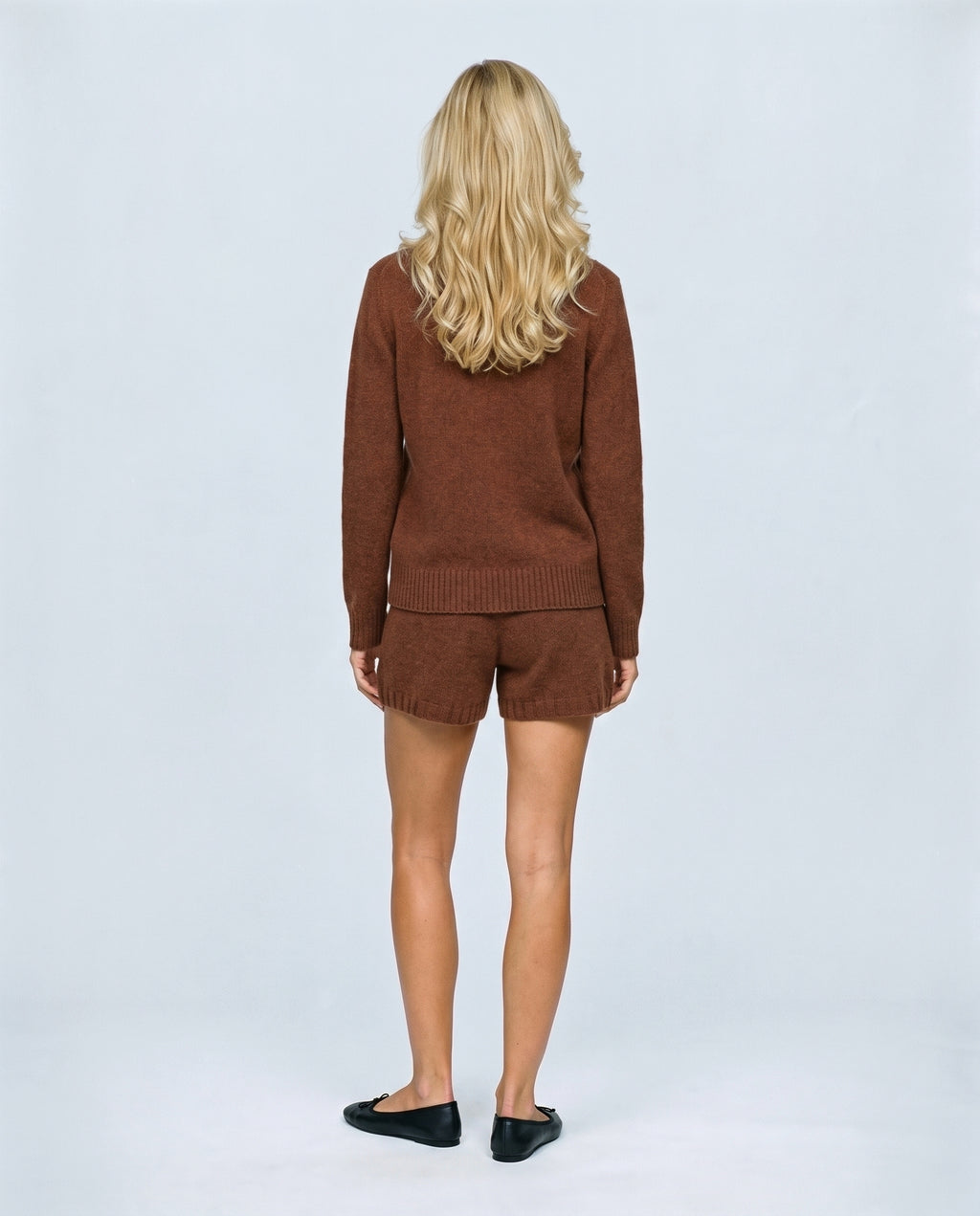 The Knit Cardigan & Shorts Set in Rust brown, back view on a non-pregnant model