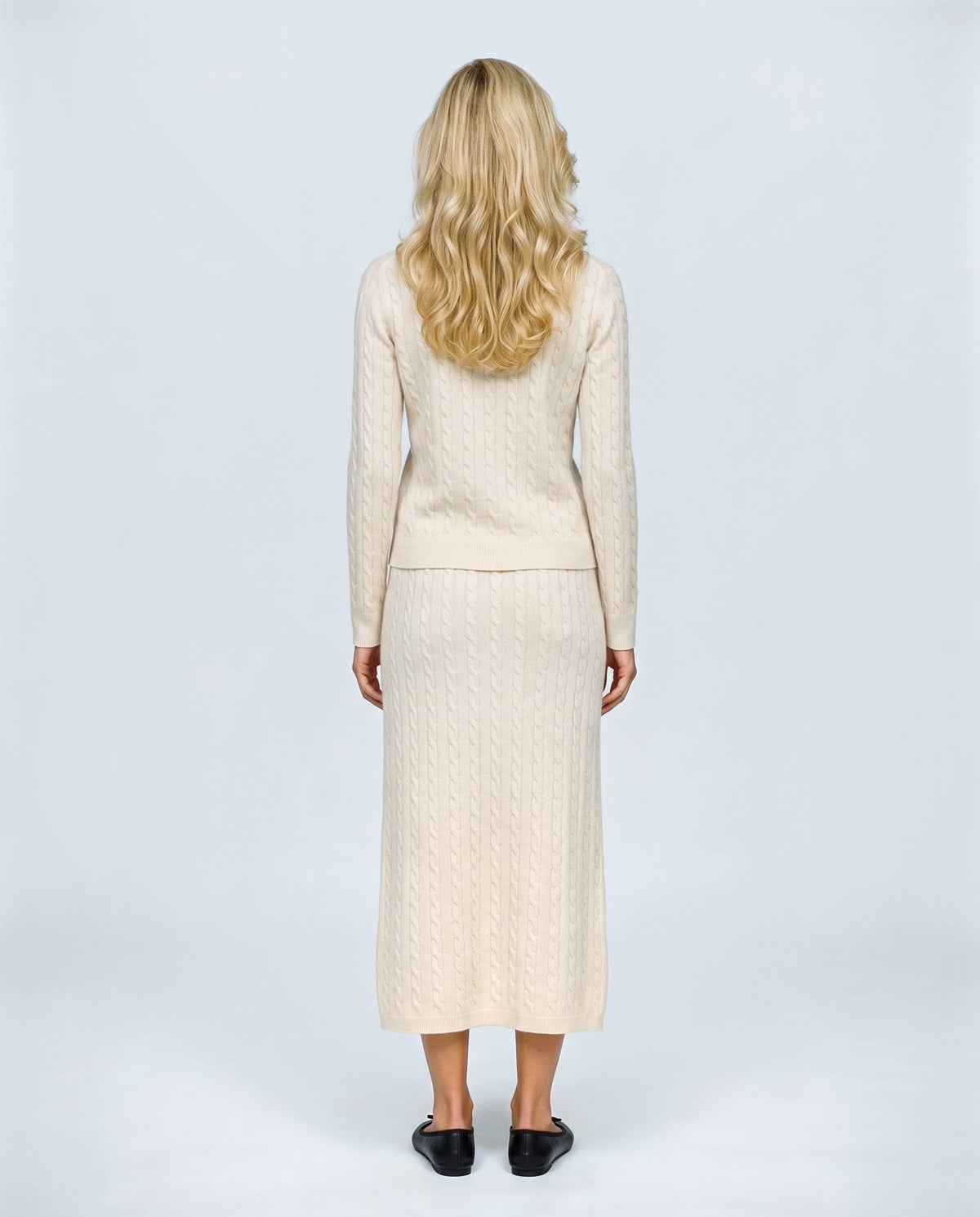 The Textured Knit Top & Skirt Set in Cream, back view on a non-pregnant model