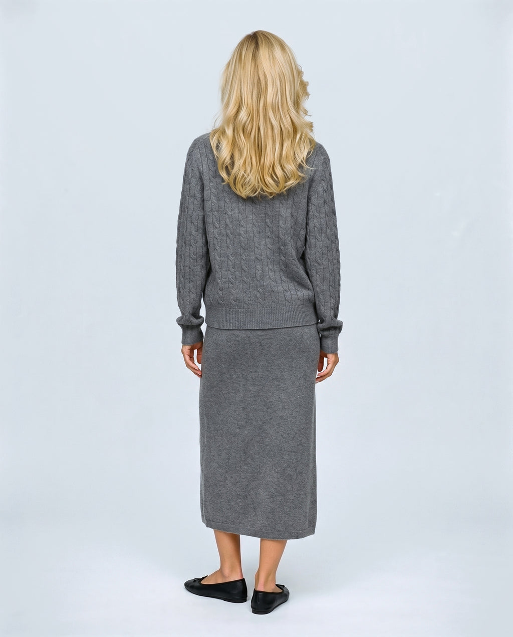 The Textured Knit Top & Skirt Set in Grey, back view on a non-pregnant model