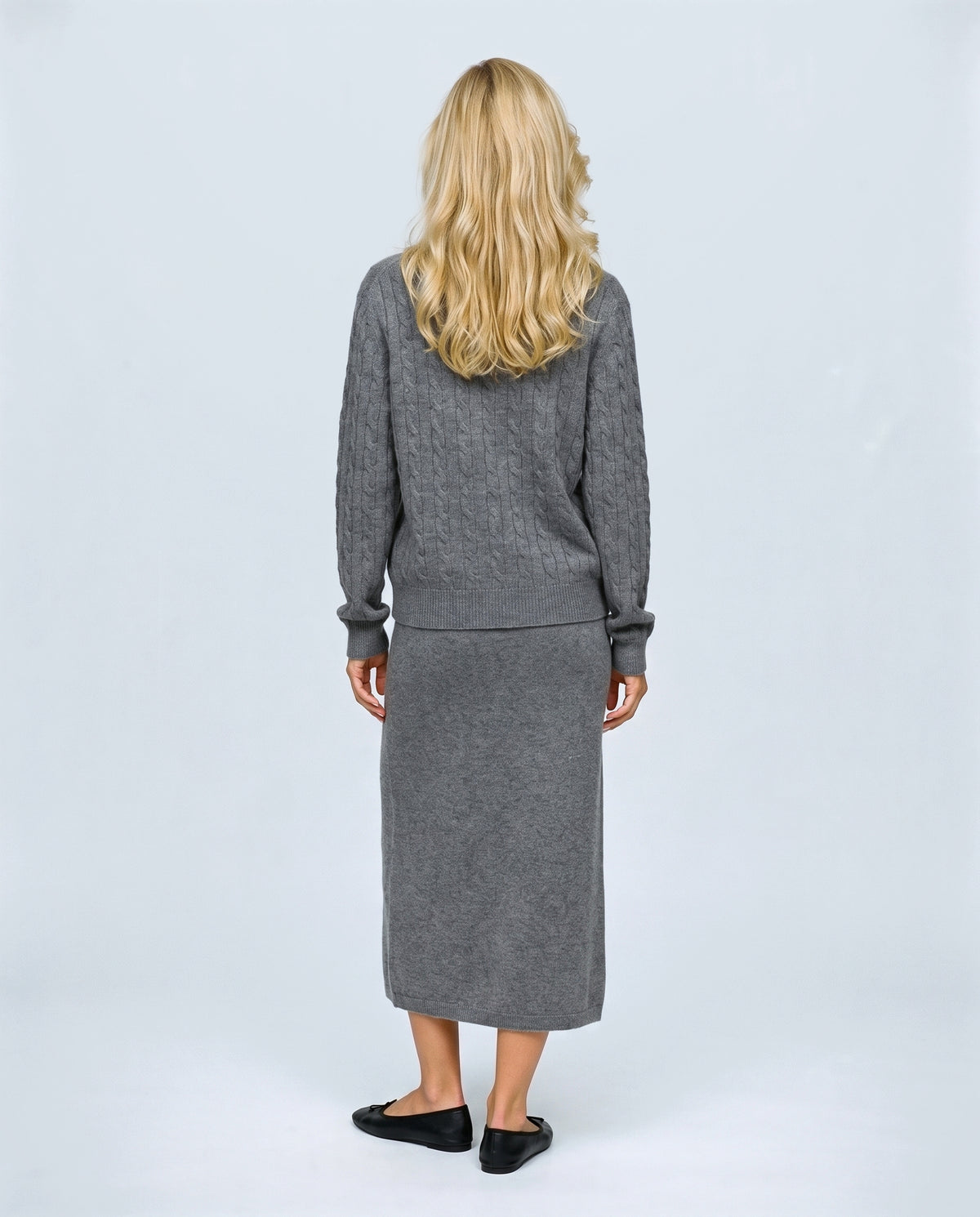 The Textured Knit Top & Skirt Set in Grey, back view on a non-pregnant model