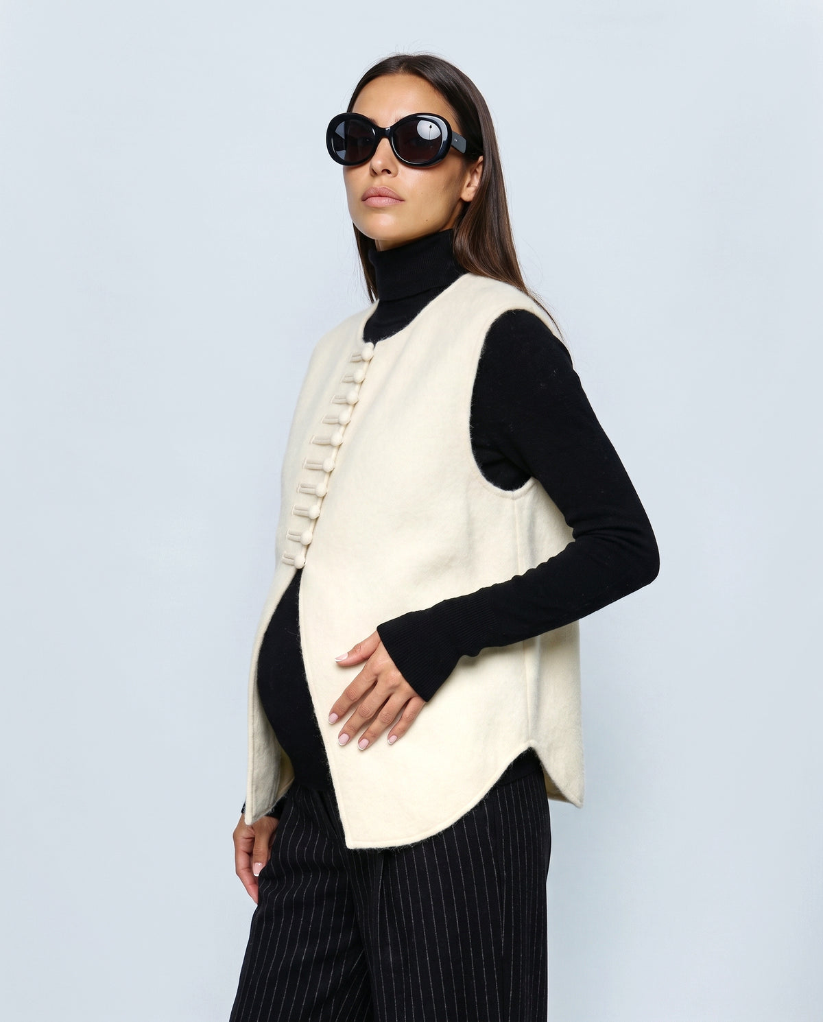 The Knot-Button Knit Vest in Cream, side close-up