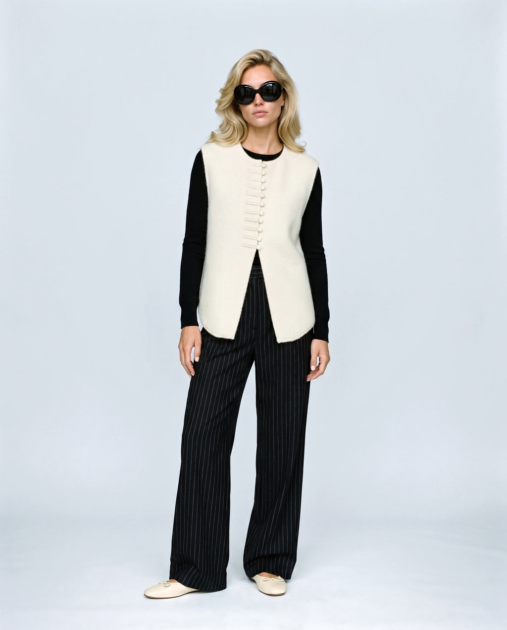 The Knot-Button Knit Vest in Cream, front view on a non-pregnant model