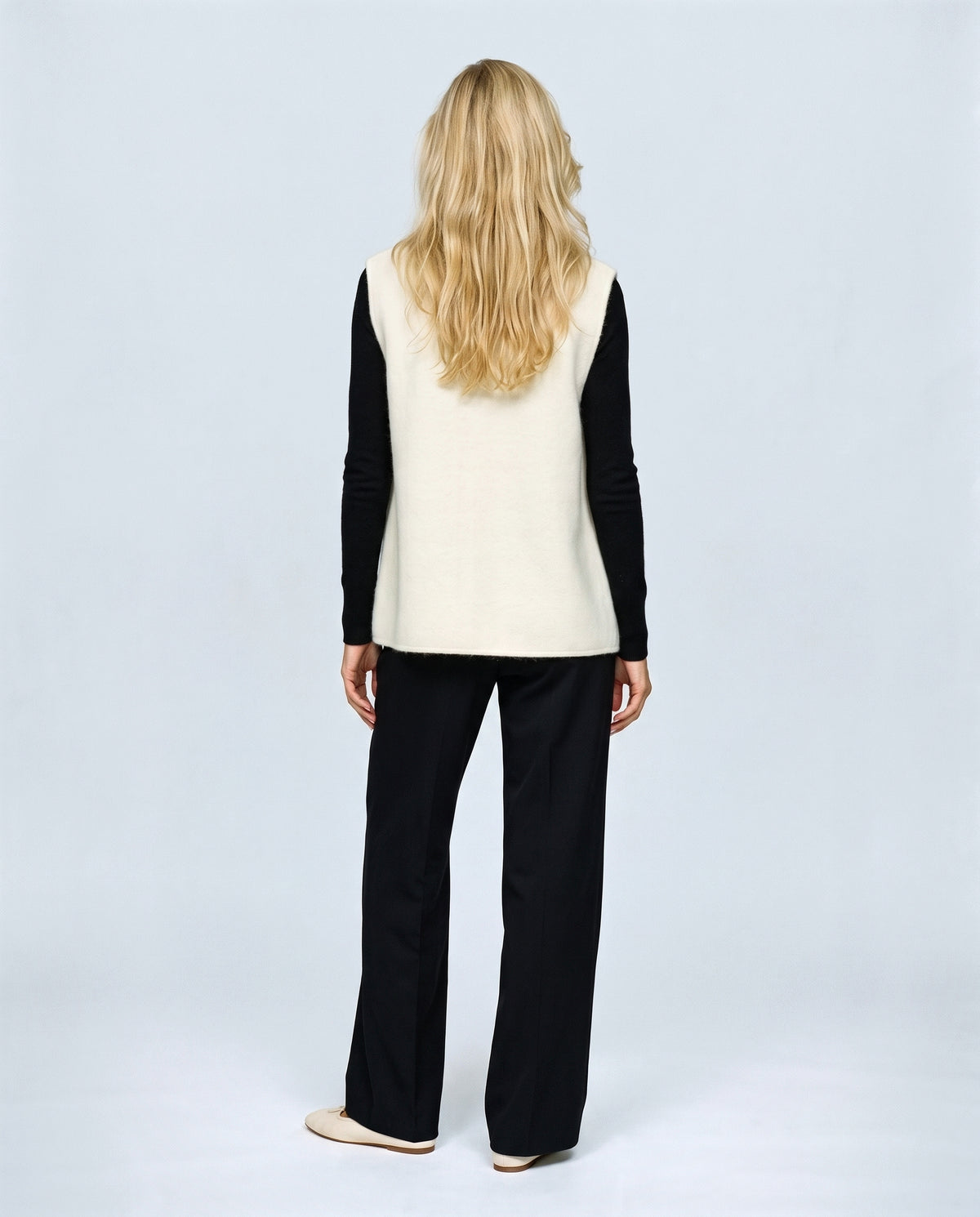 The Knot-Button Knit Vest in Cream, back view on a non-pregnant model