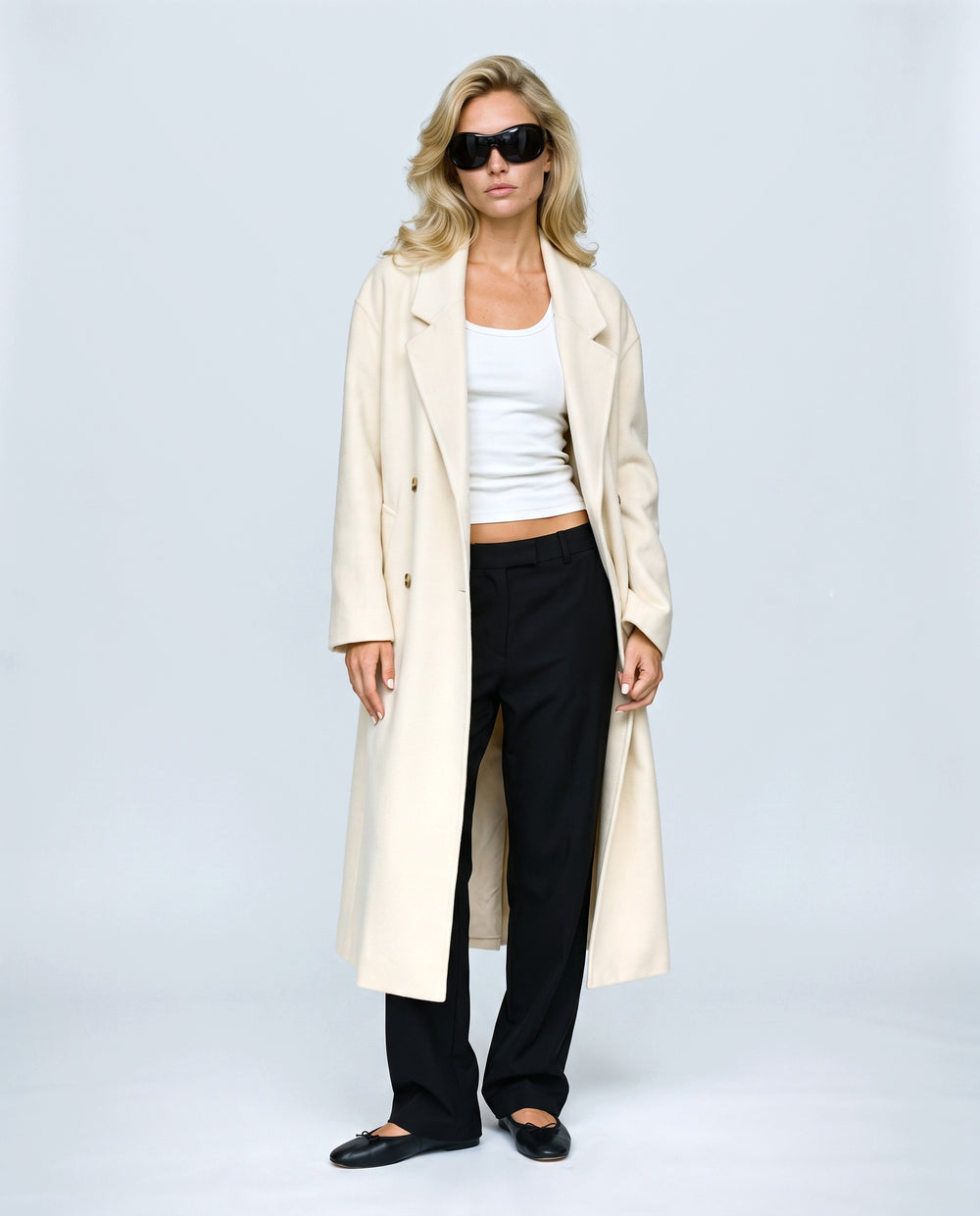 The Cocoon Overcoat in Cream, front view on a non-pregnant model