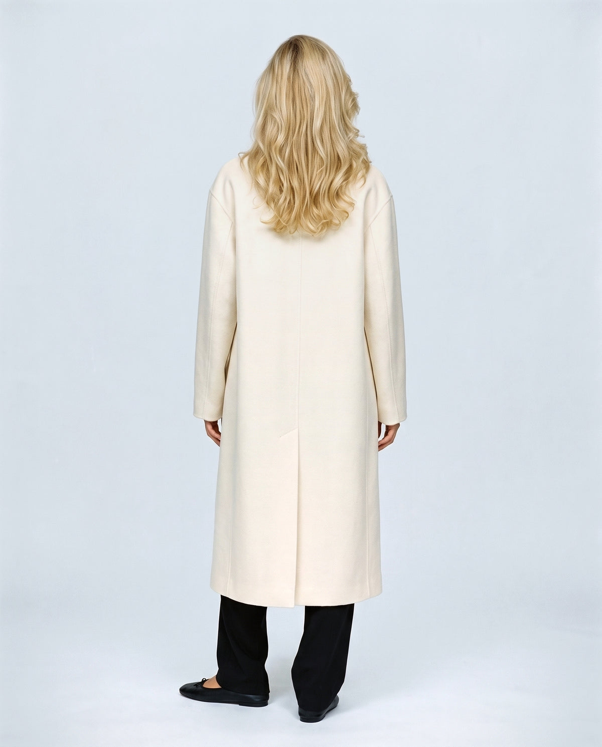 The Cocoon Overcoat in Cream, back view on a non-pregnant model
