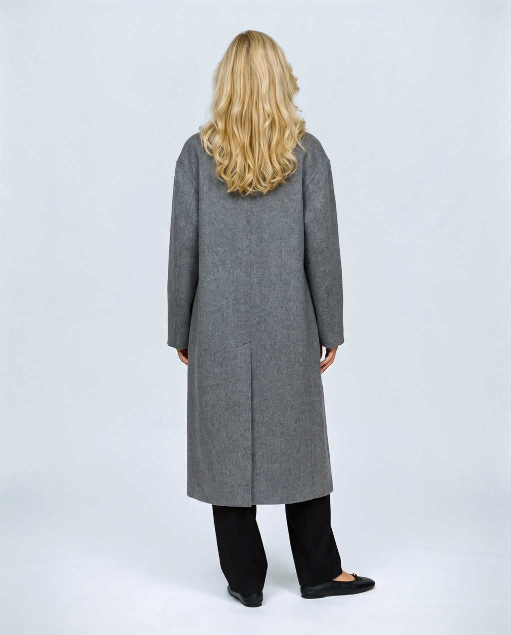 The Cocoon Overcoat in Grey, back view on a non-pregnant model