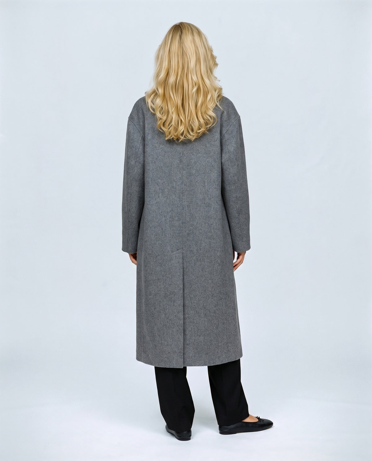 The Cocoon Overcoat in Grey, back view on a non-pregnant model