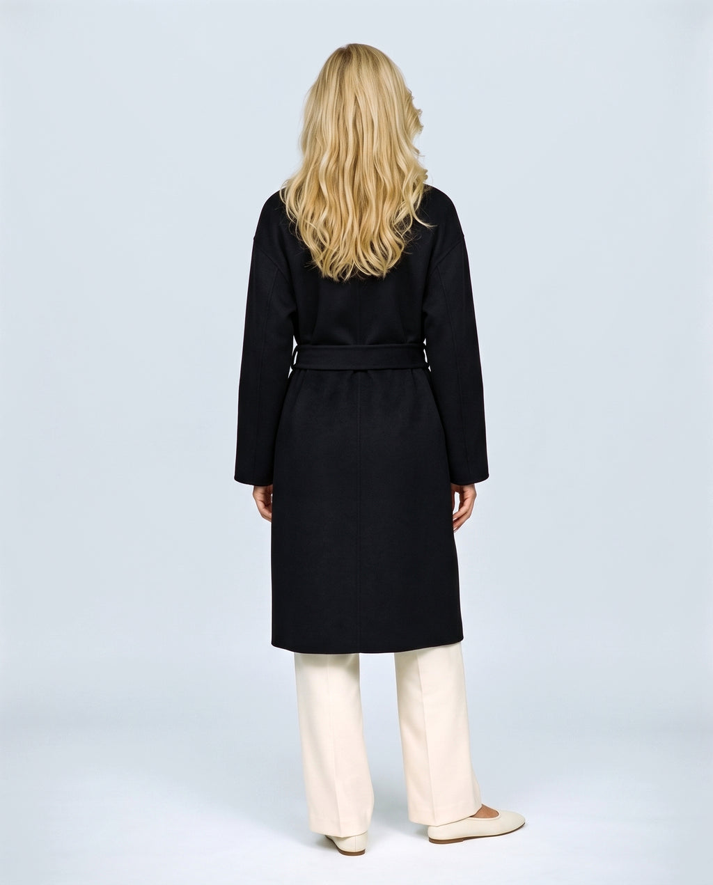 The Belted Stand-Collar Coat in Black, back view on a non-pregnant model