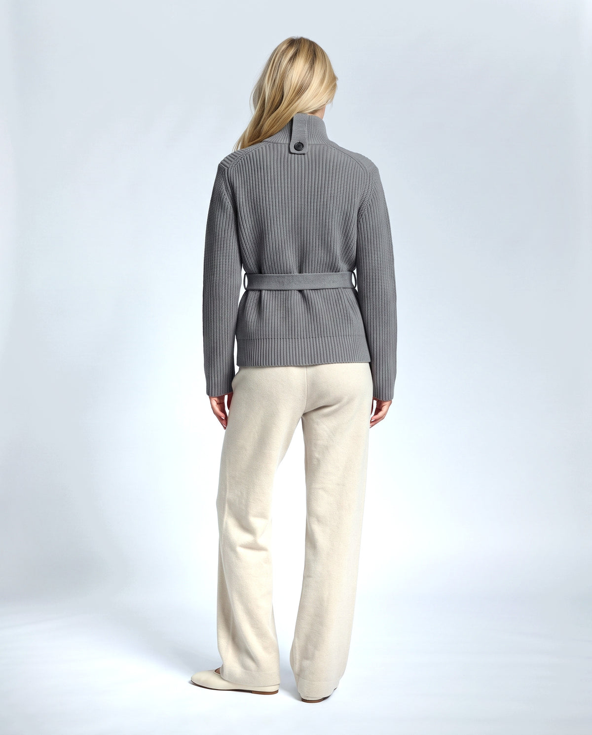The Belted High-Neck Cardigan in Grey, back view on a non-pregnant model