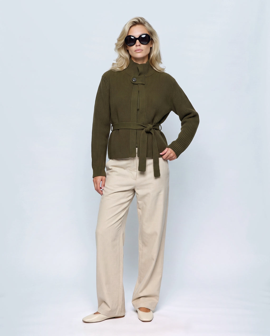The Belted High-Neck Cardigan in Olive, front view on a non-pregnant model