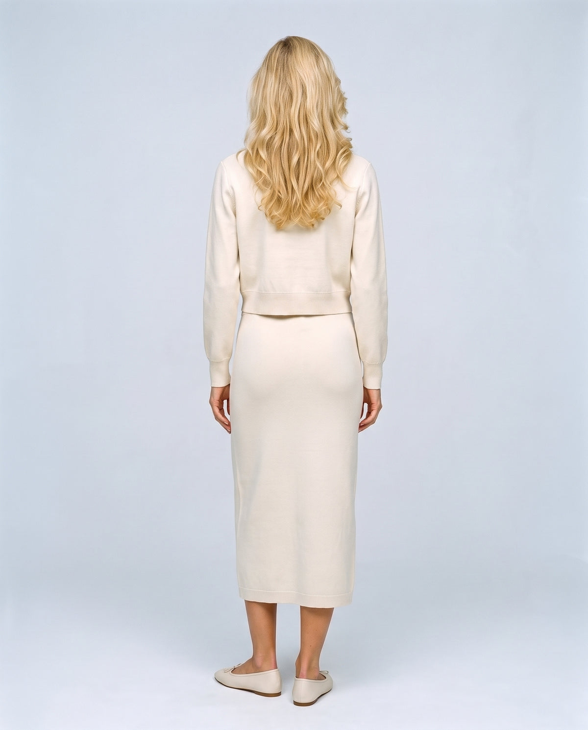 The Knit Blazer & Skirt Set in White, back view on a non-pregnant model