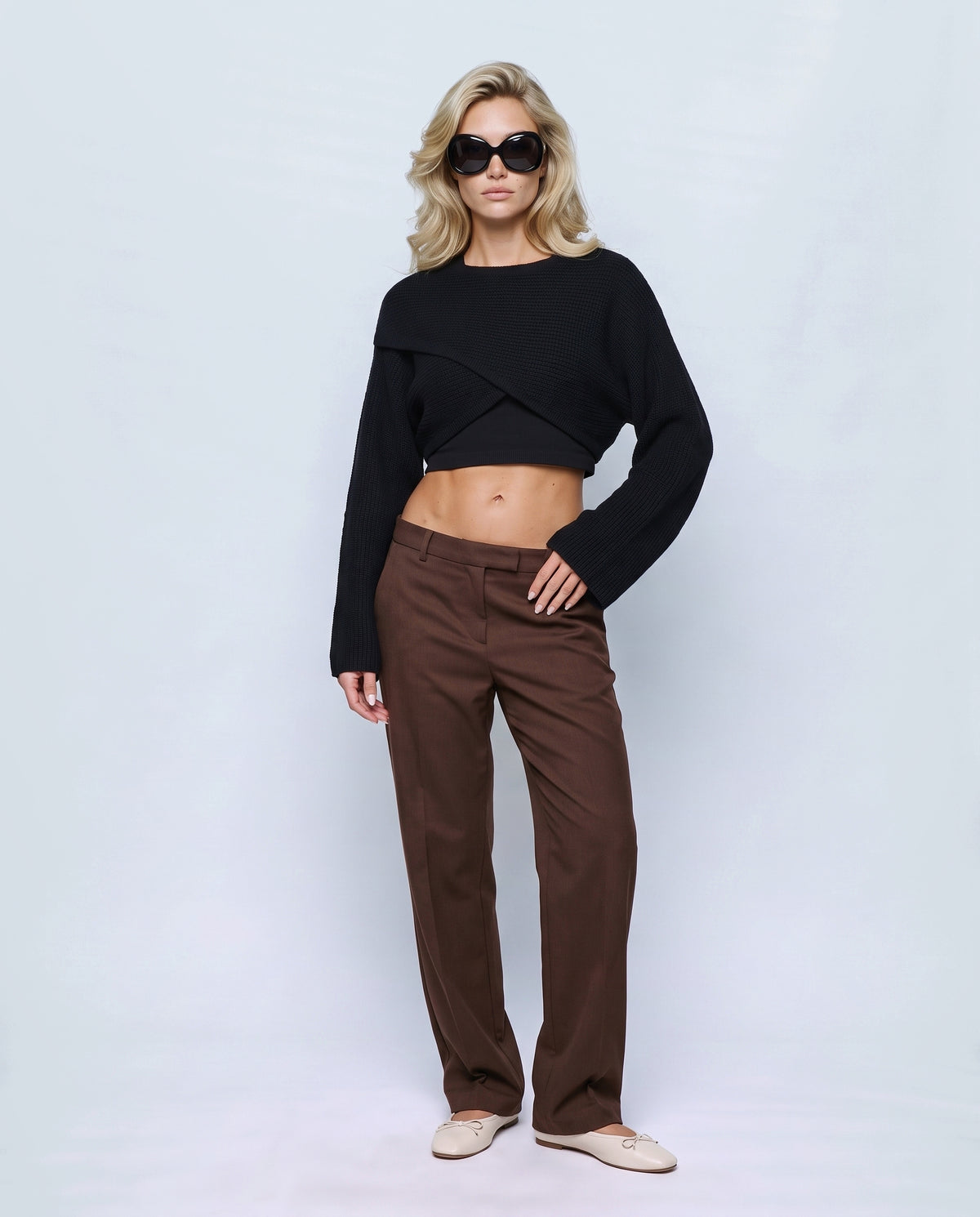 The Crossover Cropped Knit in Black, front view on a non-pregnant model