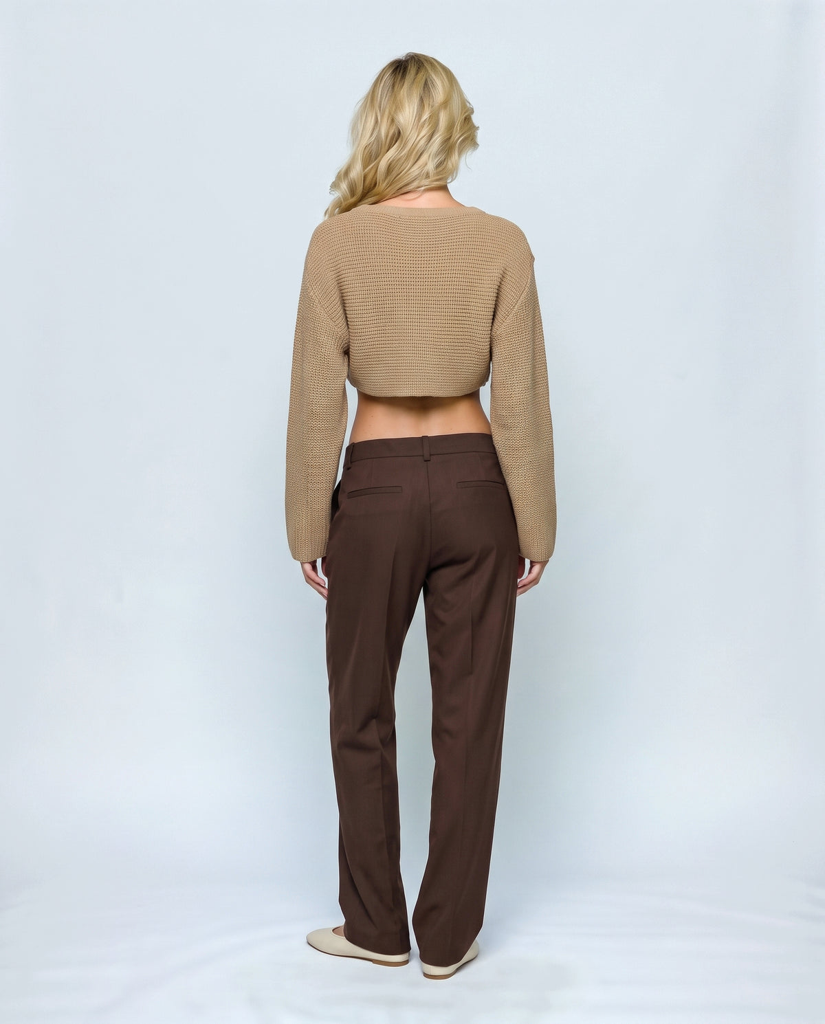 The Crossover Cropped Knit in Camel, back view on a non-pregnant model