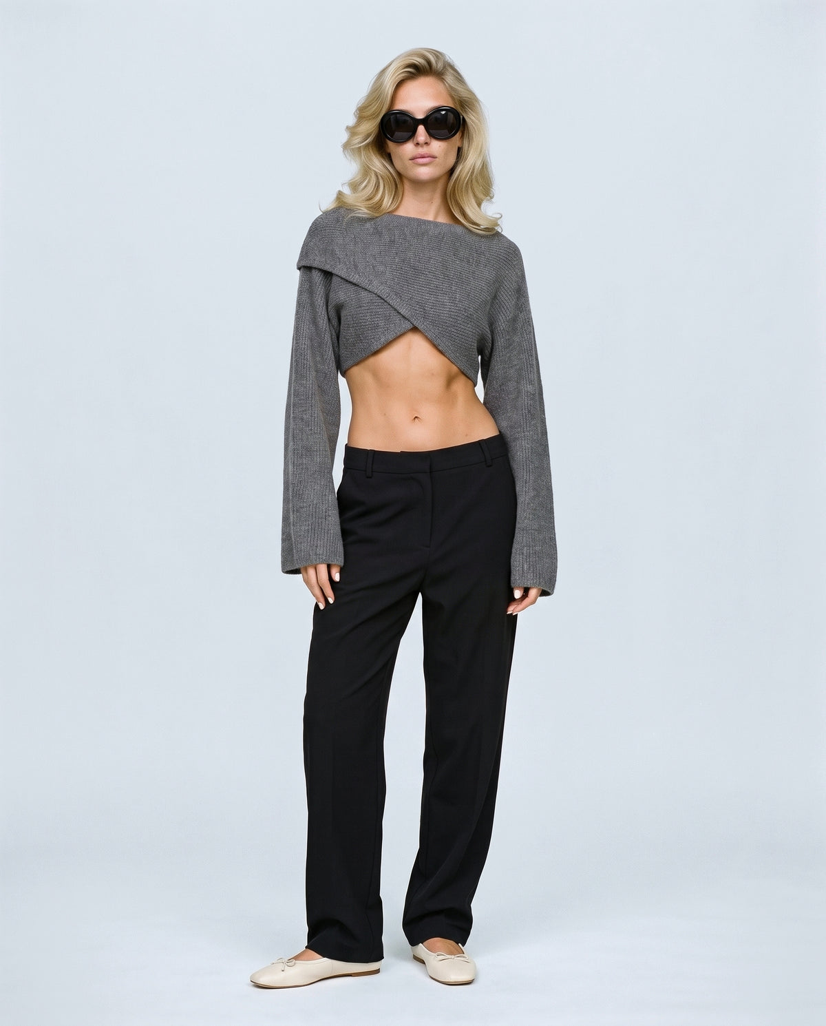The Crossover Cropped Knit in Grey, front view on a non-pregnant model