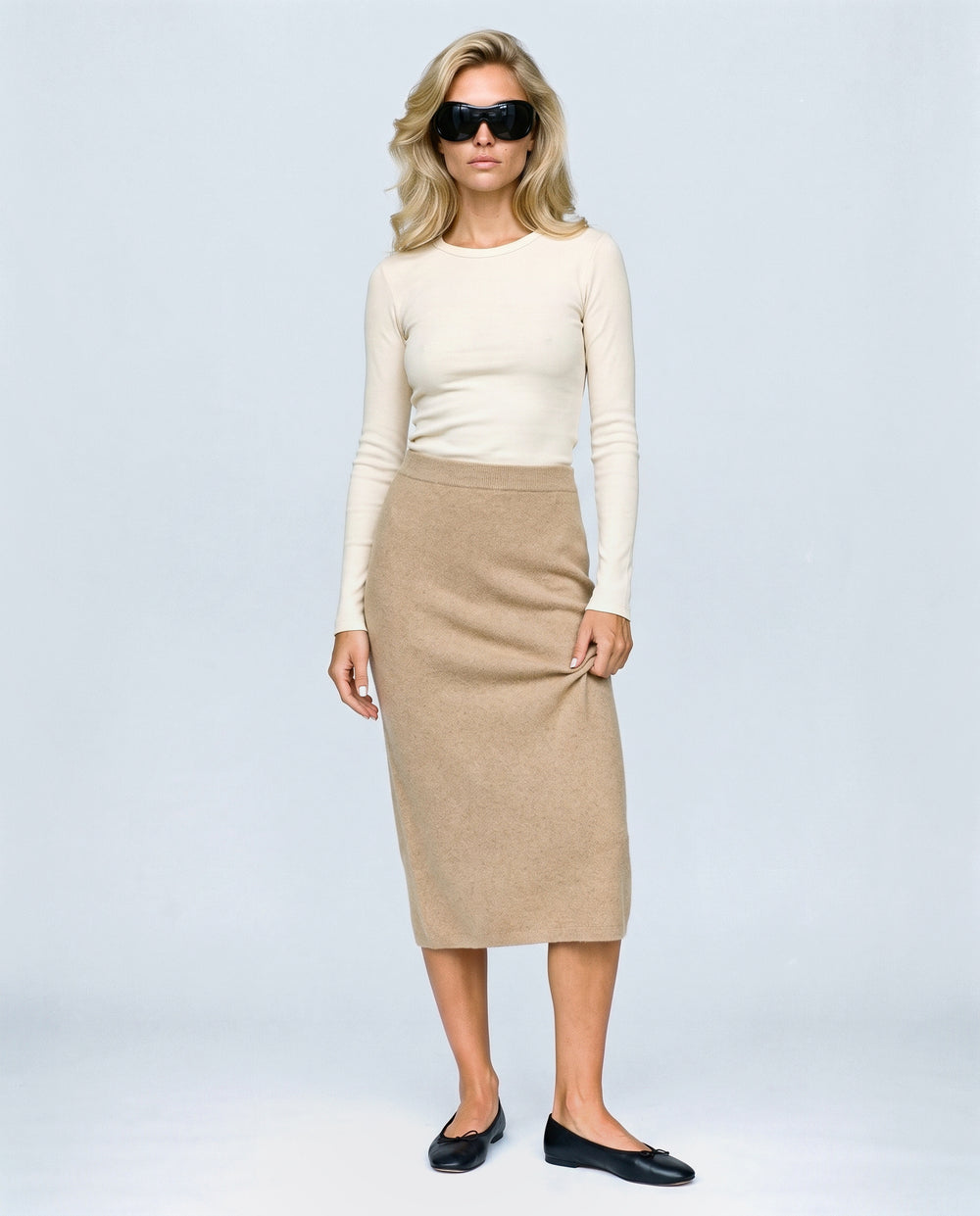 The Column Knit Skirt in Camel, front view on a non-pregnant model