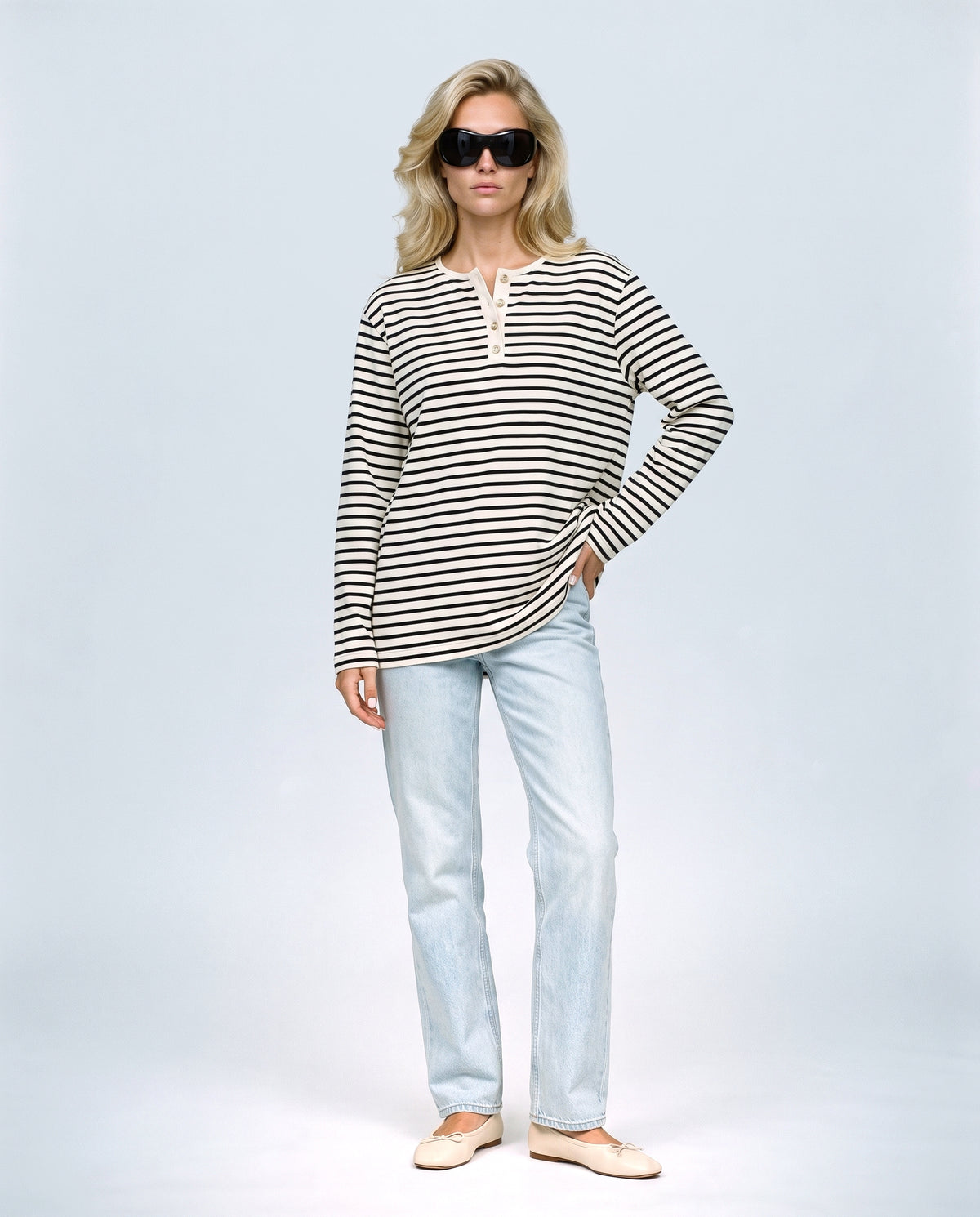 The Relaxed Maternity Stripe Top in Black stripe, front view on a non-pregnant model