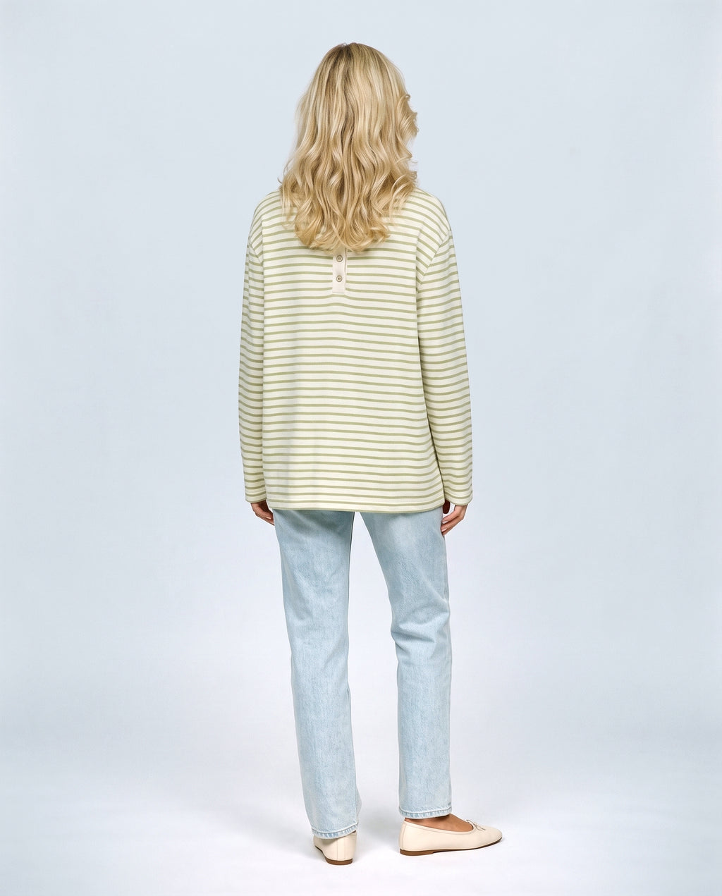 The Relaxed Maternity Stripe Top in Olive stripe, back view on a non-pregnant model