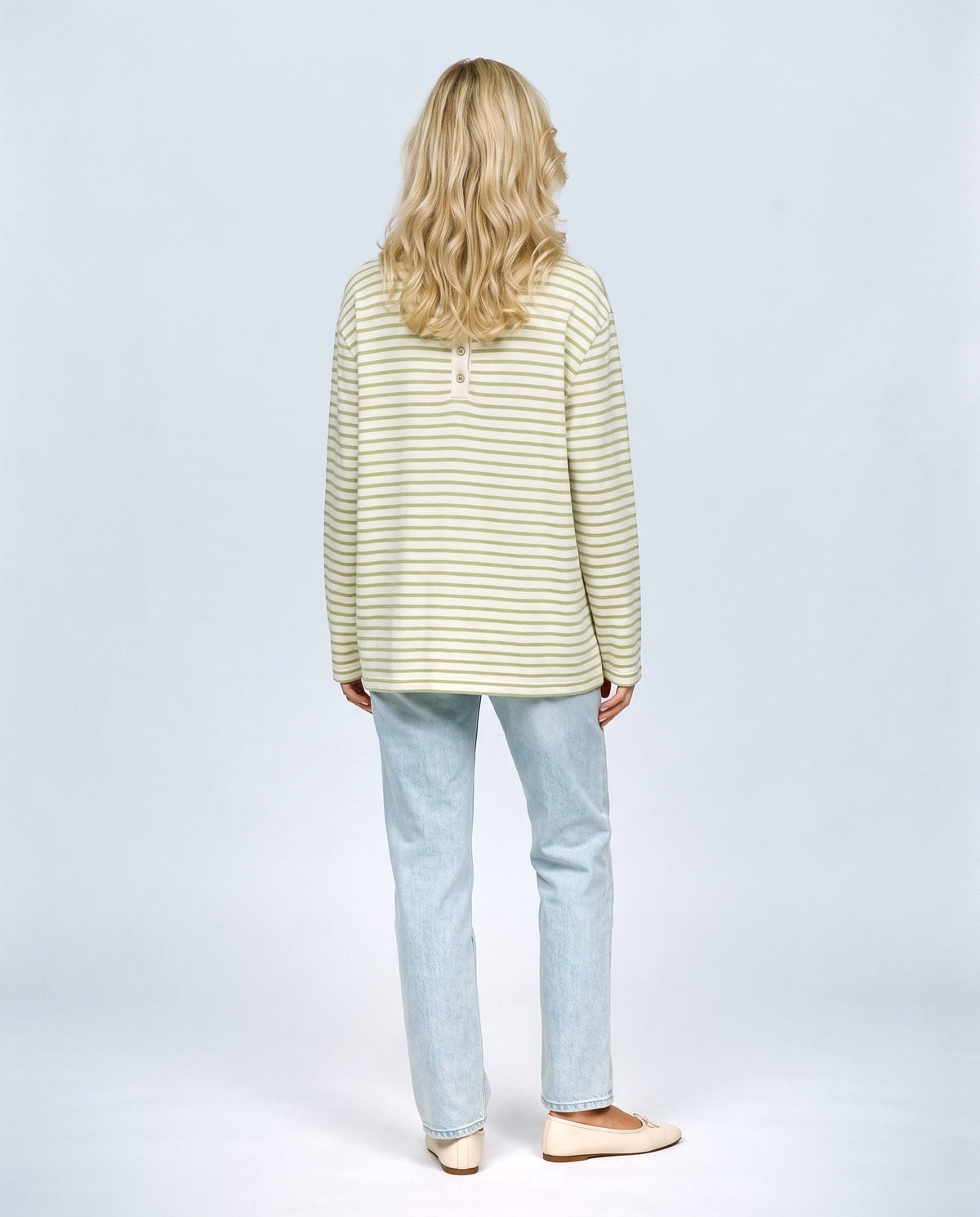 The Relaxed Maternity Stripe Top in Olive stripe, back view on a non-pregnant model