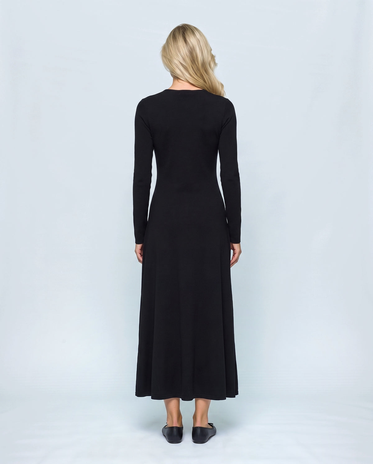 Sylvie V-Neck Knit Maxi Dress in Black, back view on a non-pregnant model