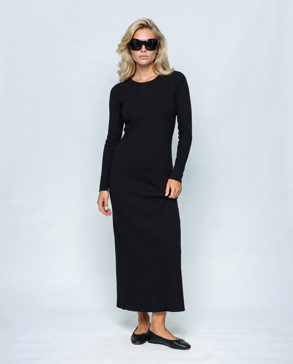 The Longline Knit Dress in Black, front view on a non-pregnant model