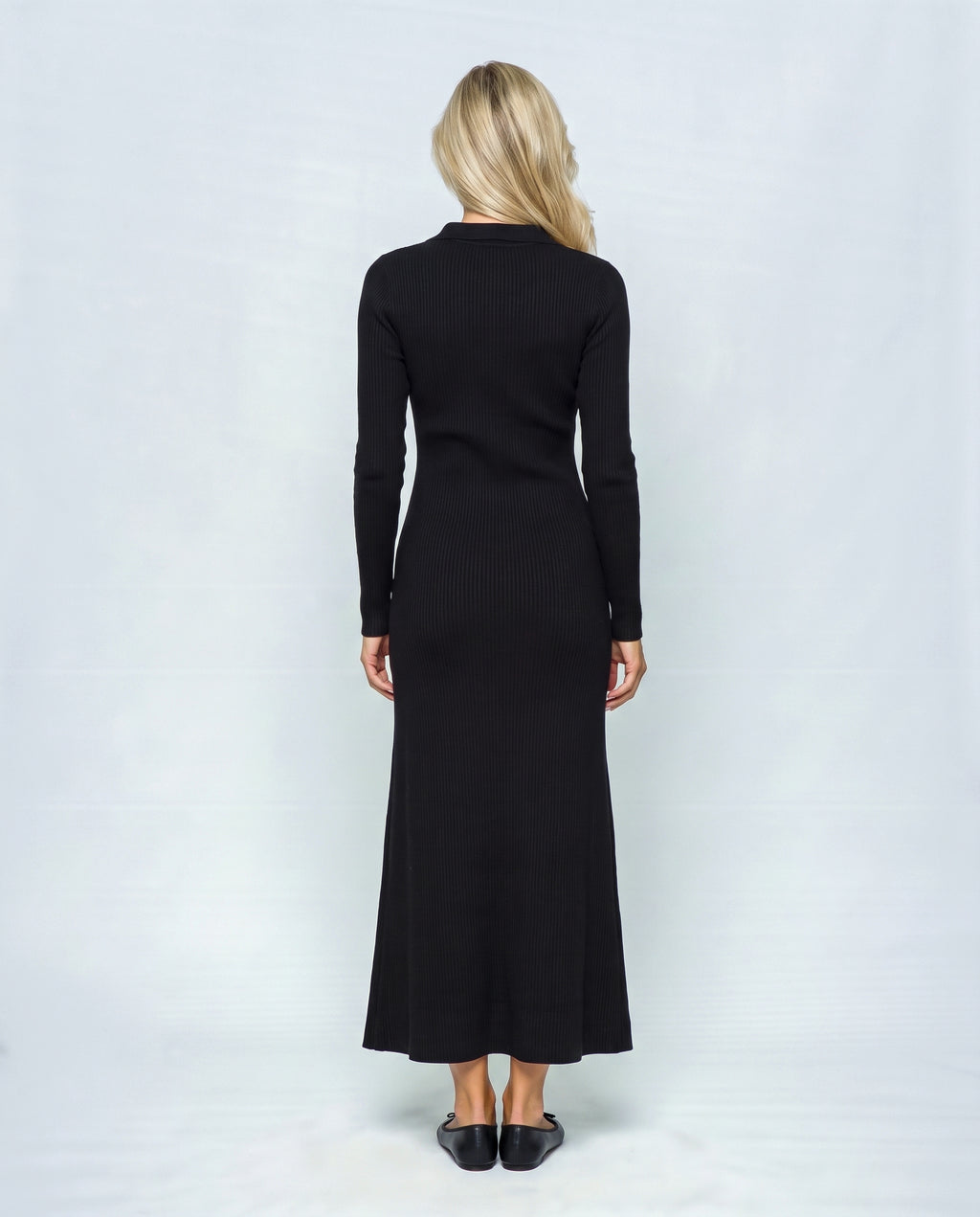 The Longline Knit Dress in Black, back view on a non-pregnant model