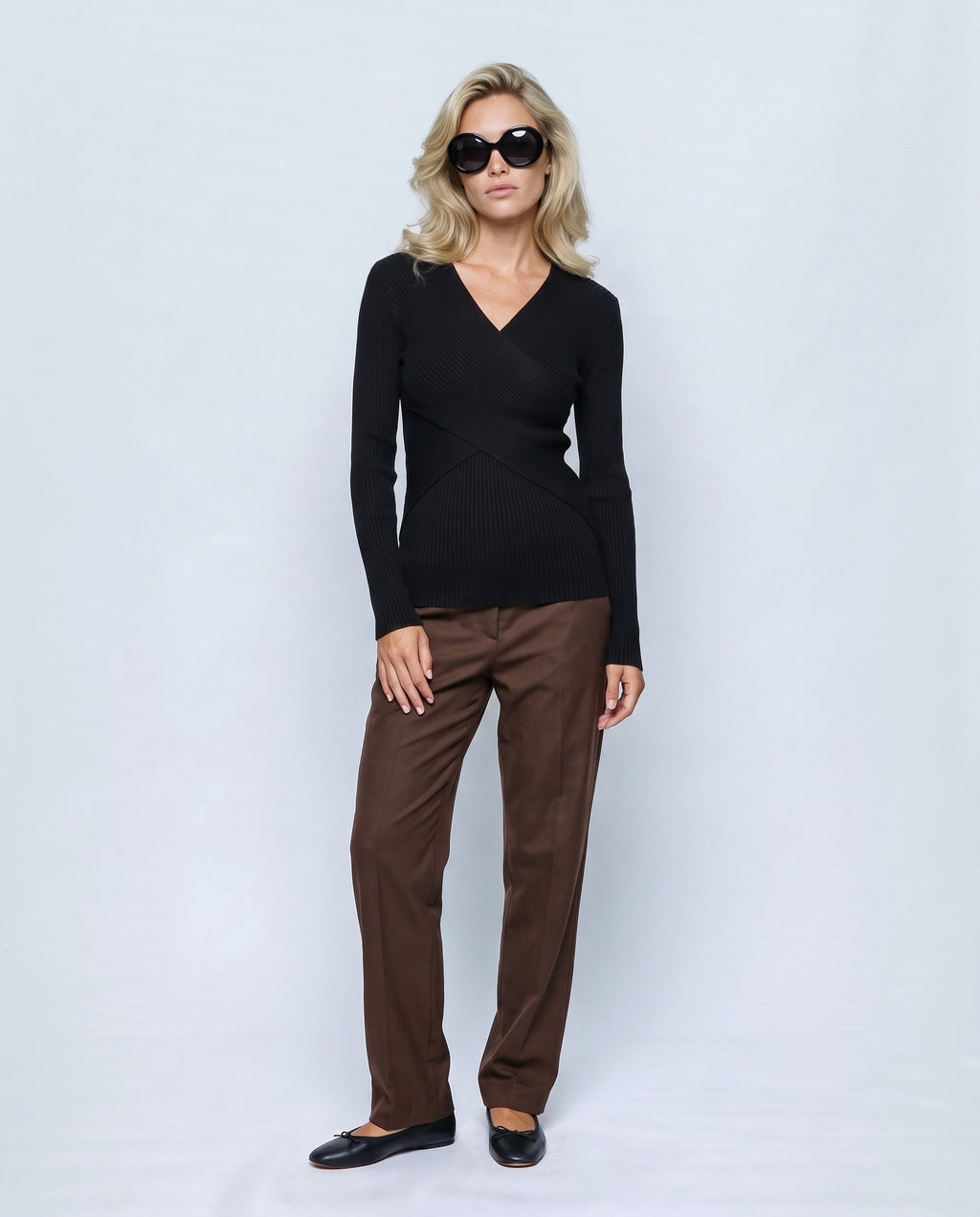 Clara Cross-Front Nursing Sweater in Black, front view on a non-pregnant model