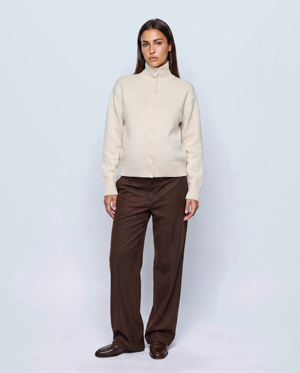 The Heritage Button Cardigan in Milk cream, closed over the bump