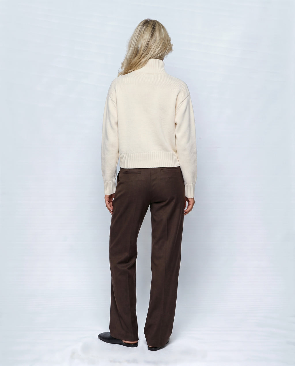 The Heritage Button Cardigan in Milk cream, back view on a non-pregnant model