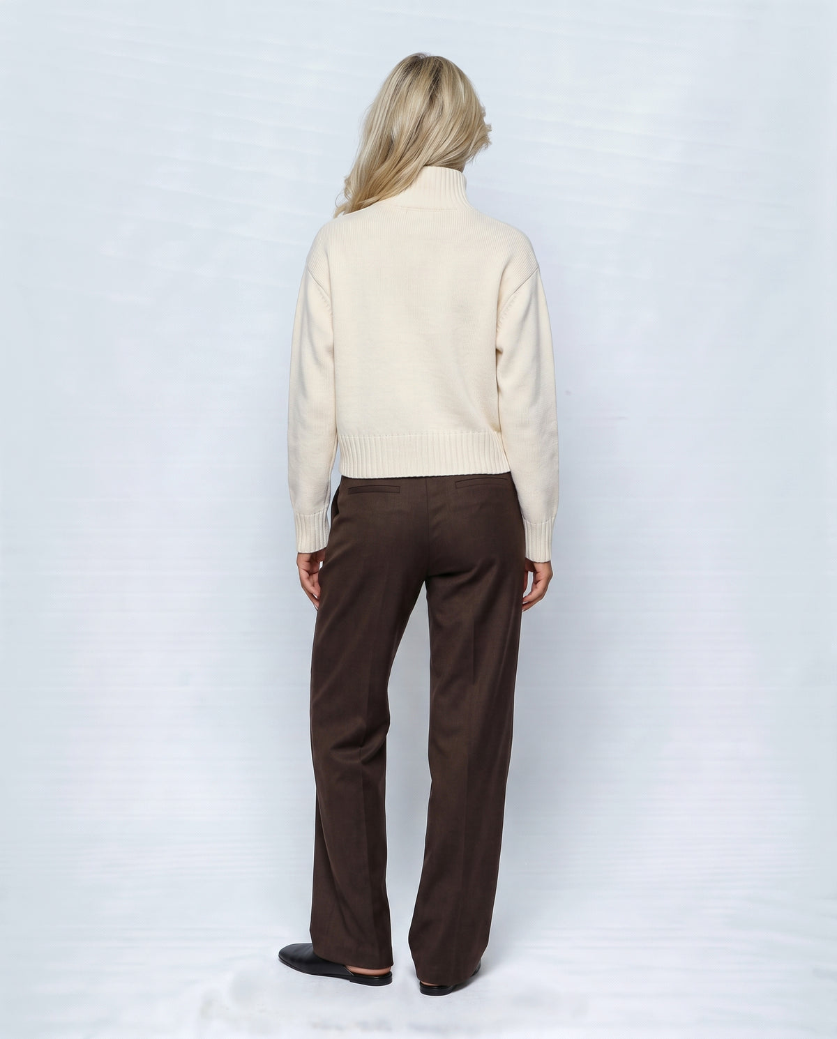 The Heritage Button Cardigan in Milk cream, back view on a non-pregnant model
