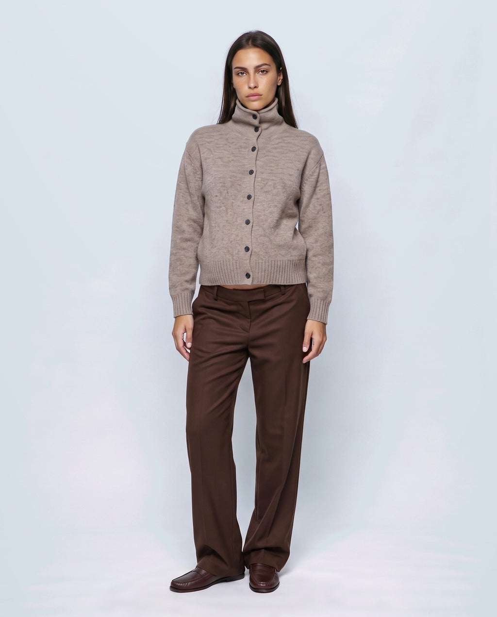 The Heritage Button Cardigan in Oatmeal camel, closed over the bump