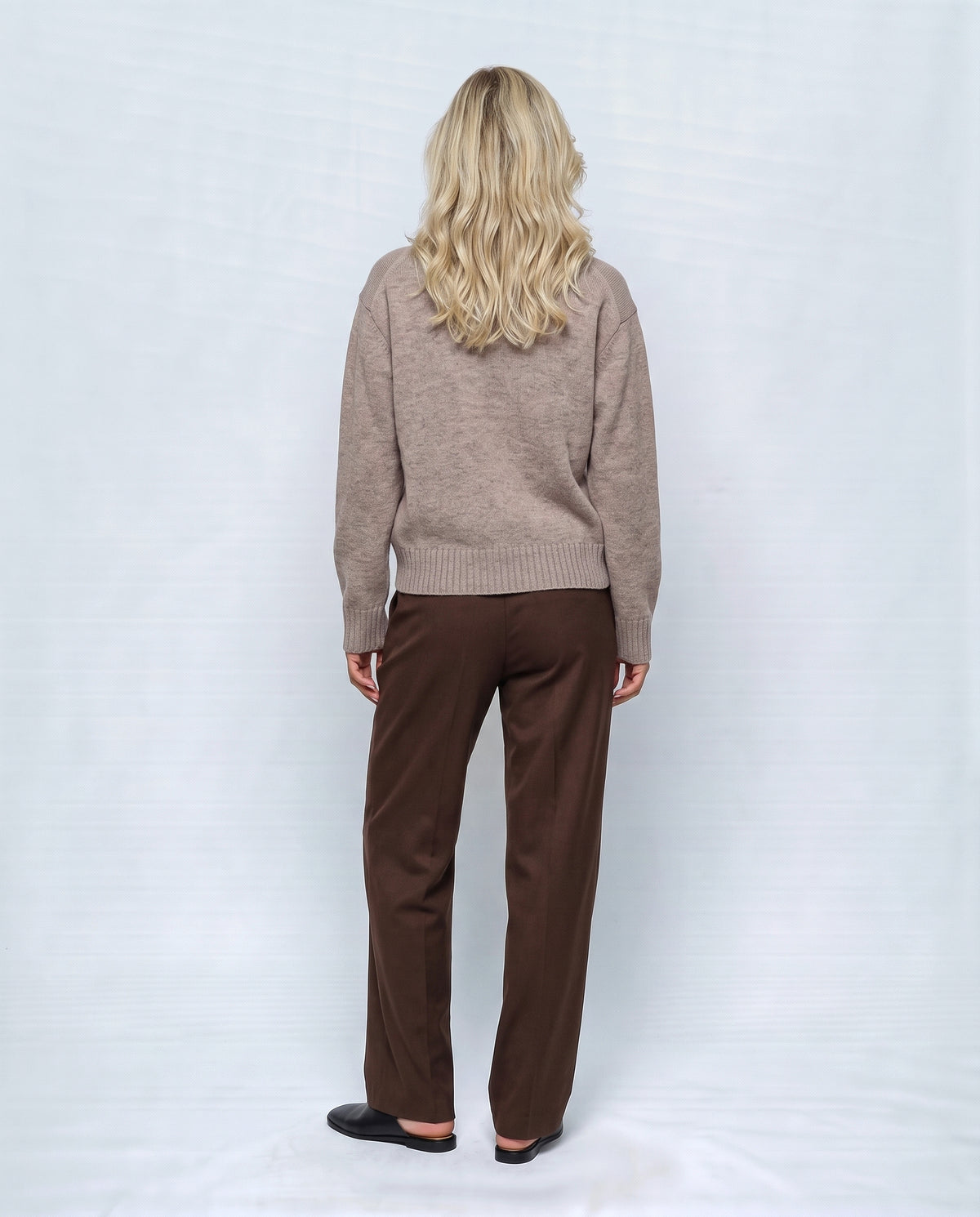 The Heritage Button Cardigan in Oatmeal camel, back view on a non-pregnant model