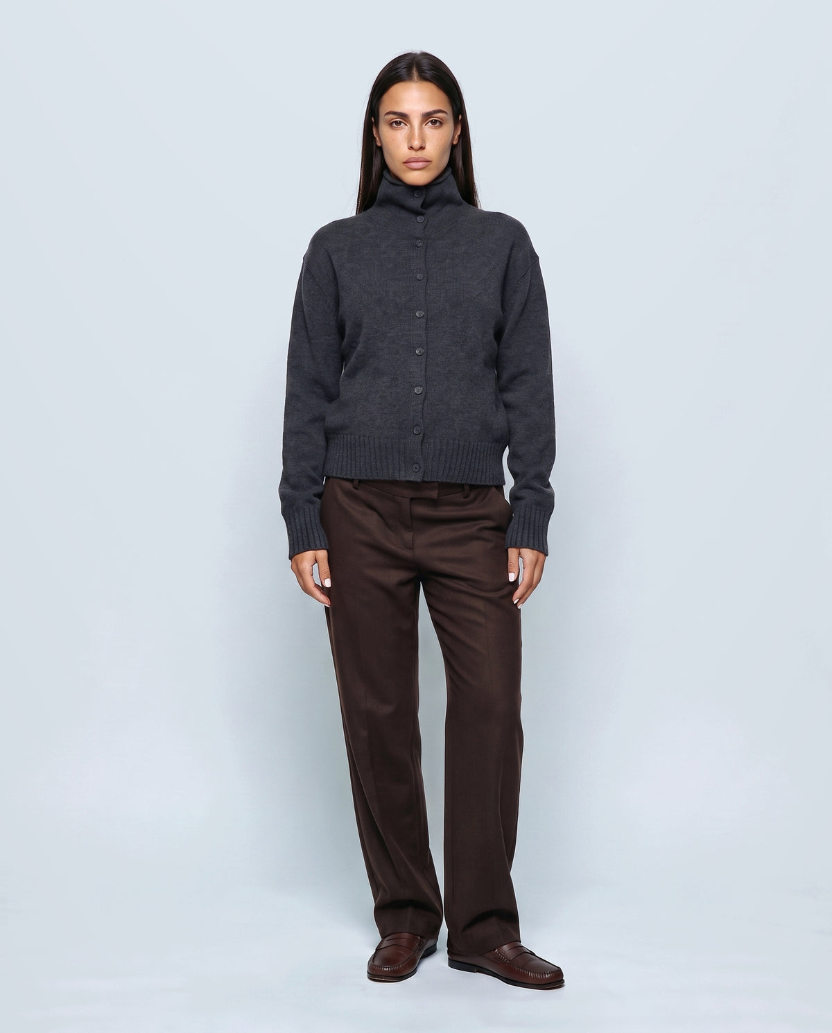 The Heritage Button Cardigan in Smoke charcoal, closed over the bump