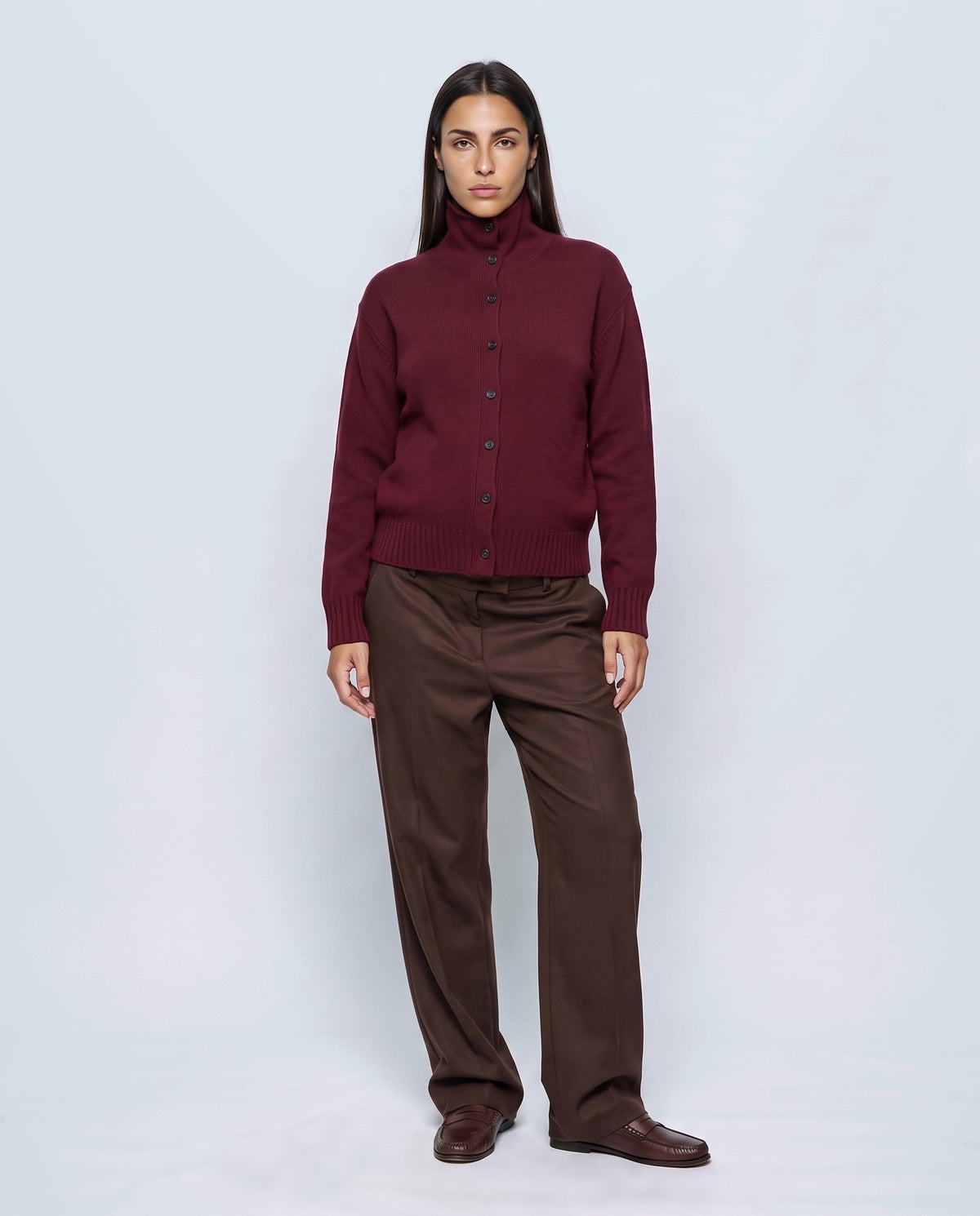 The Heritage Button Cardigan in Vintage burgundy, closed over the bump