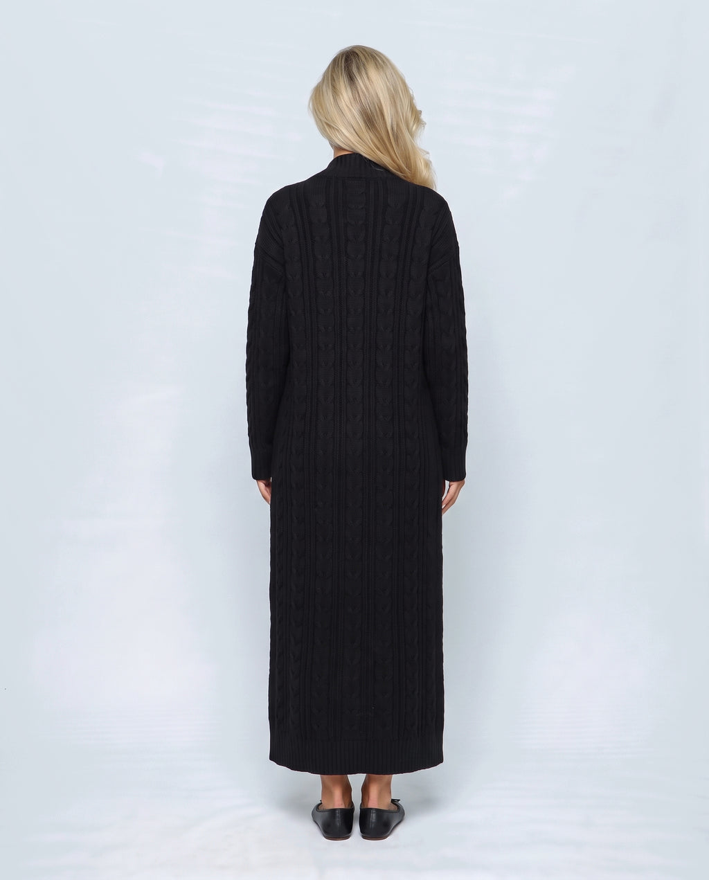 Josephine Dress & Cable Cardigan Set in Black, back view on a non-pregnant model