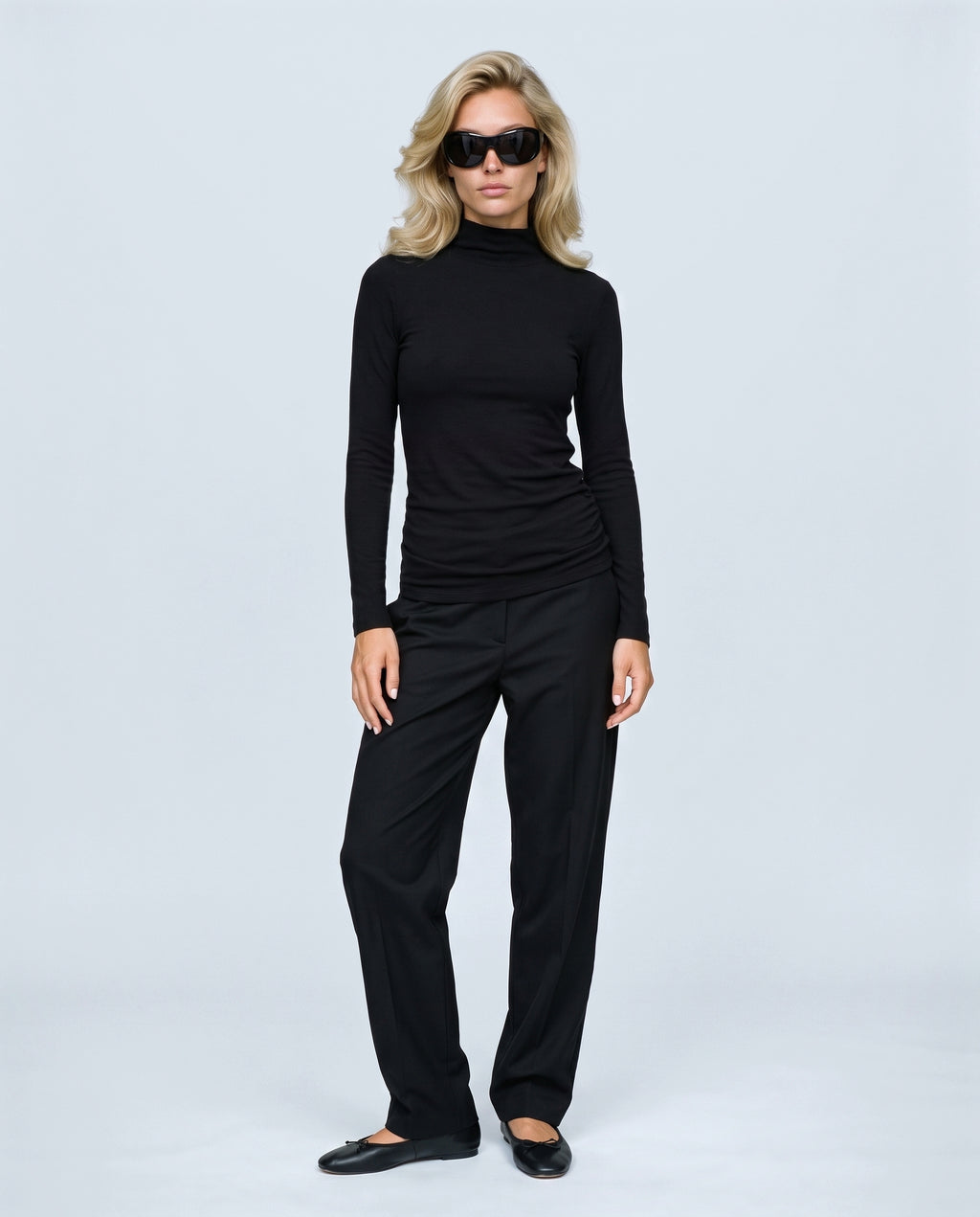 The Maternity Mock-Neck Top in Black, front view on a non-pregnant model