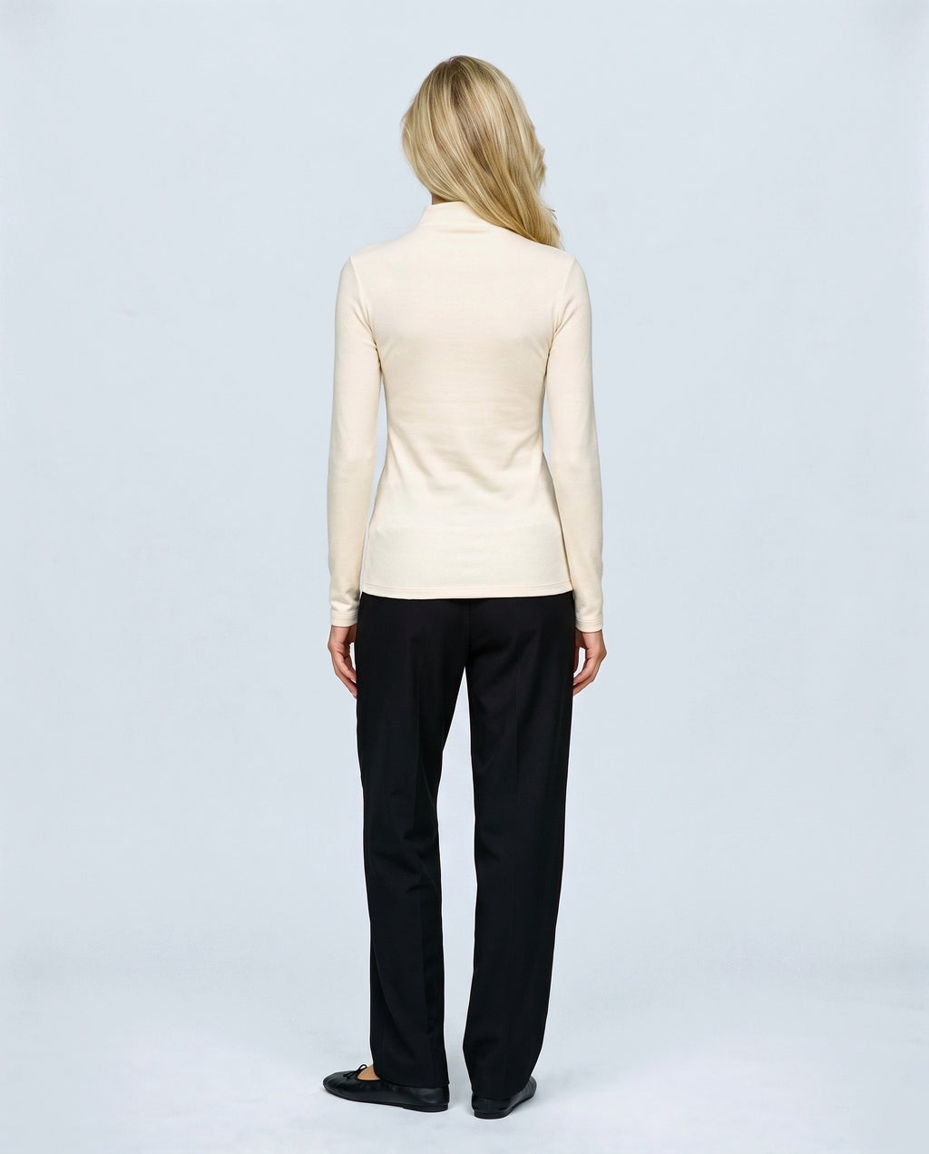 The Maternity Mock-Neck Top in Cream, back view on a non-pregnant model