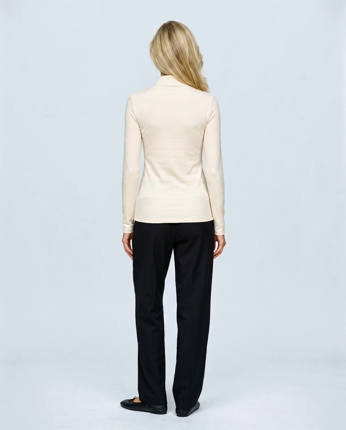 The Maternity Mock-Neck Top in Cream, back view on a non-pregnant model