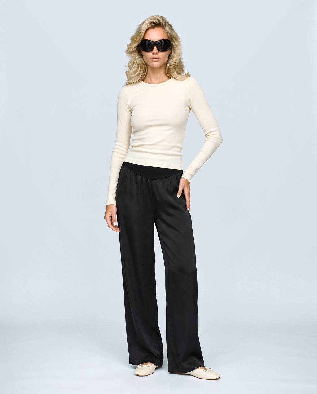 The Fluid Maternity Wide-Leg Trousers in Black, front view on a non-pregnant model