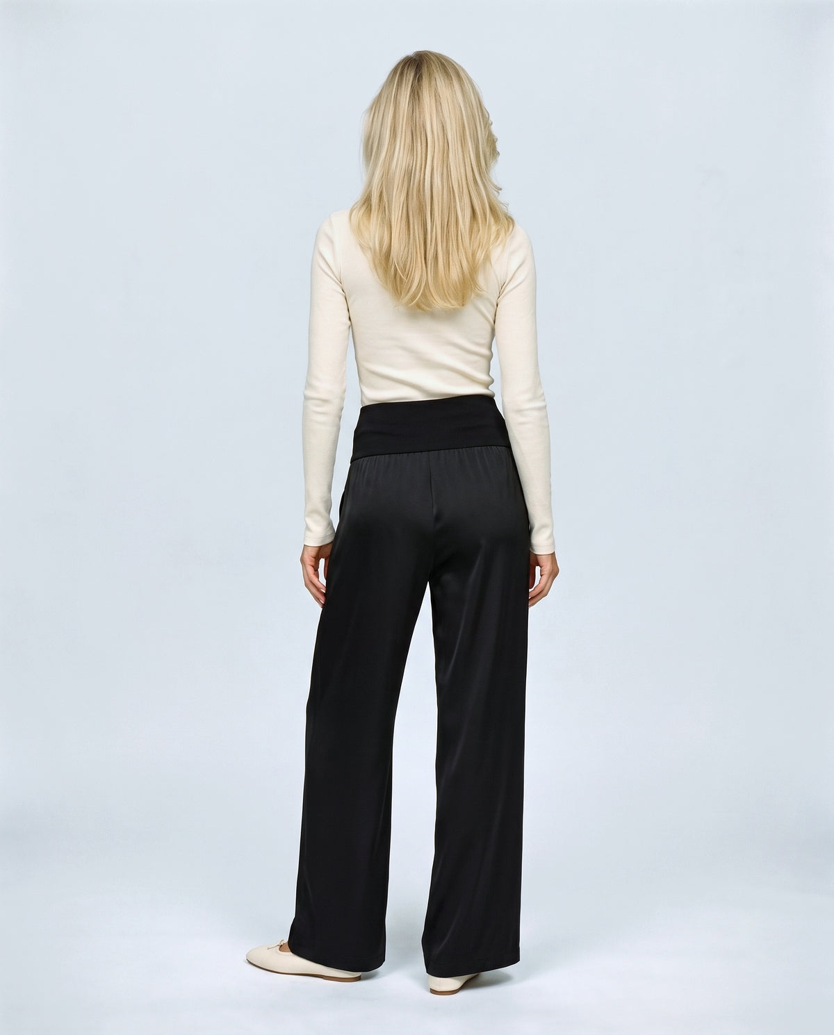 The Fluid Maternity Wide-Leg Trousers in Black, back view on a non-pregnant model