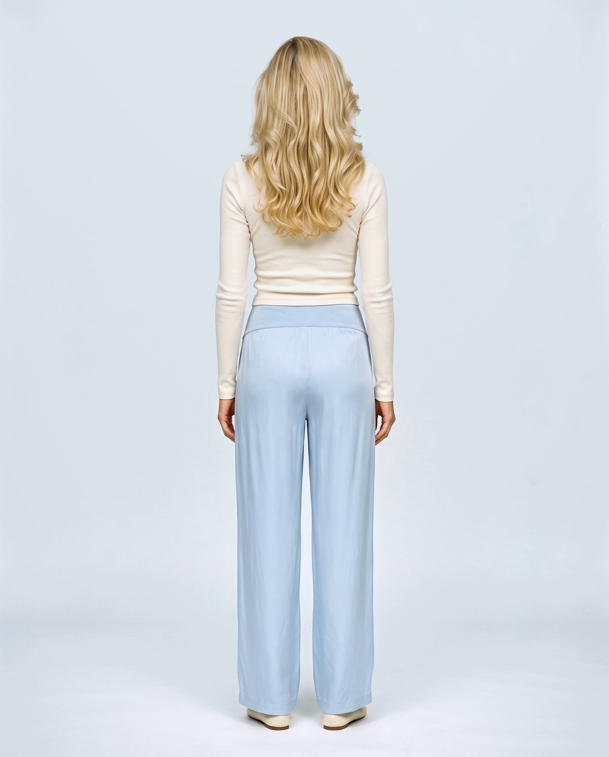 The Fluid Maternity Wide-Leg Trousers in Powder blue, back view on a non-pregnant model