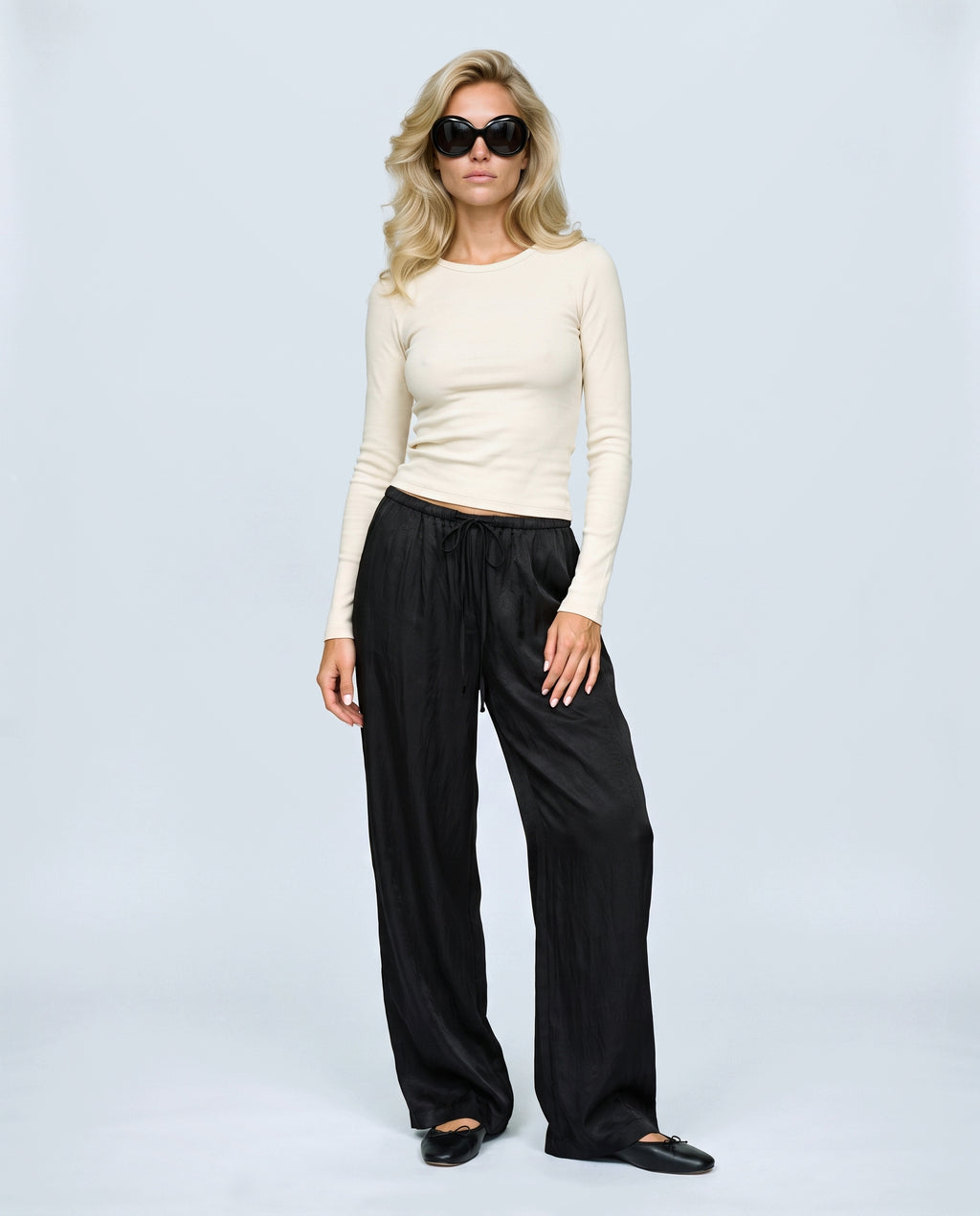The Draped Maternity Trousers in Black, front view on a non-pregnant model