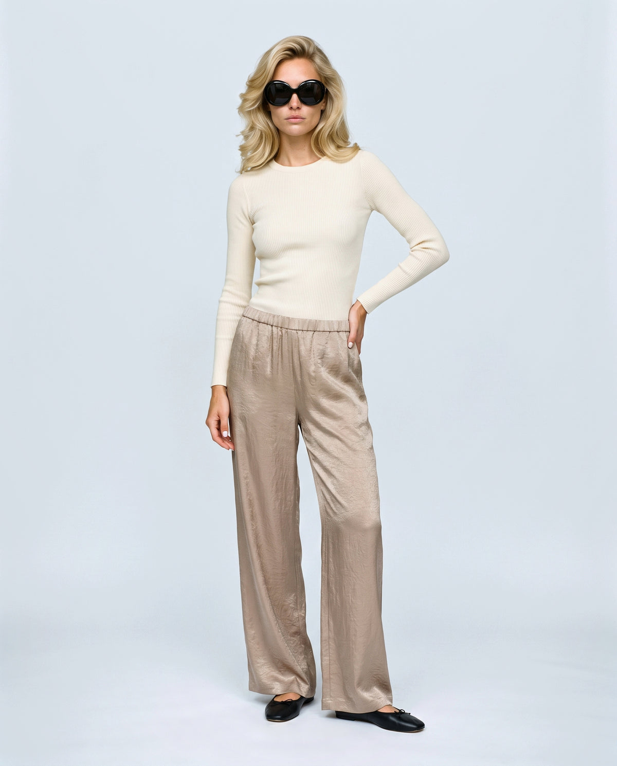 The Draped Maternity Trousers in Champagne taupe, front view on a non-pregnant model