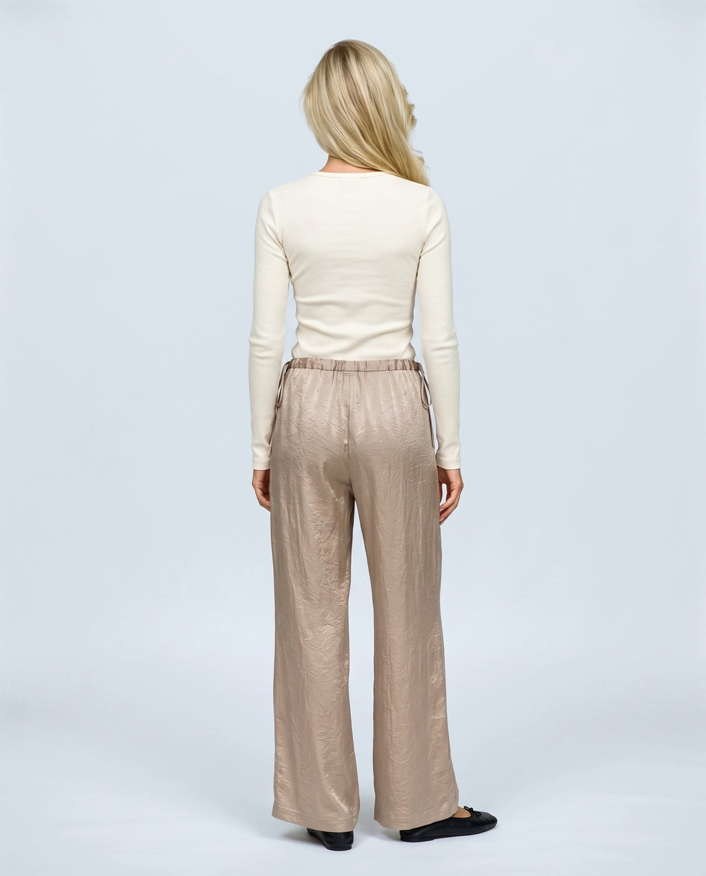 The Draped Maternity Trousers in Champagne taupe, back view on a non-pregnant model