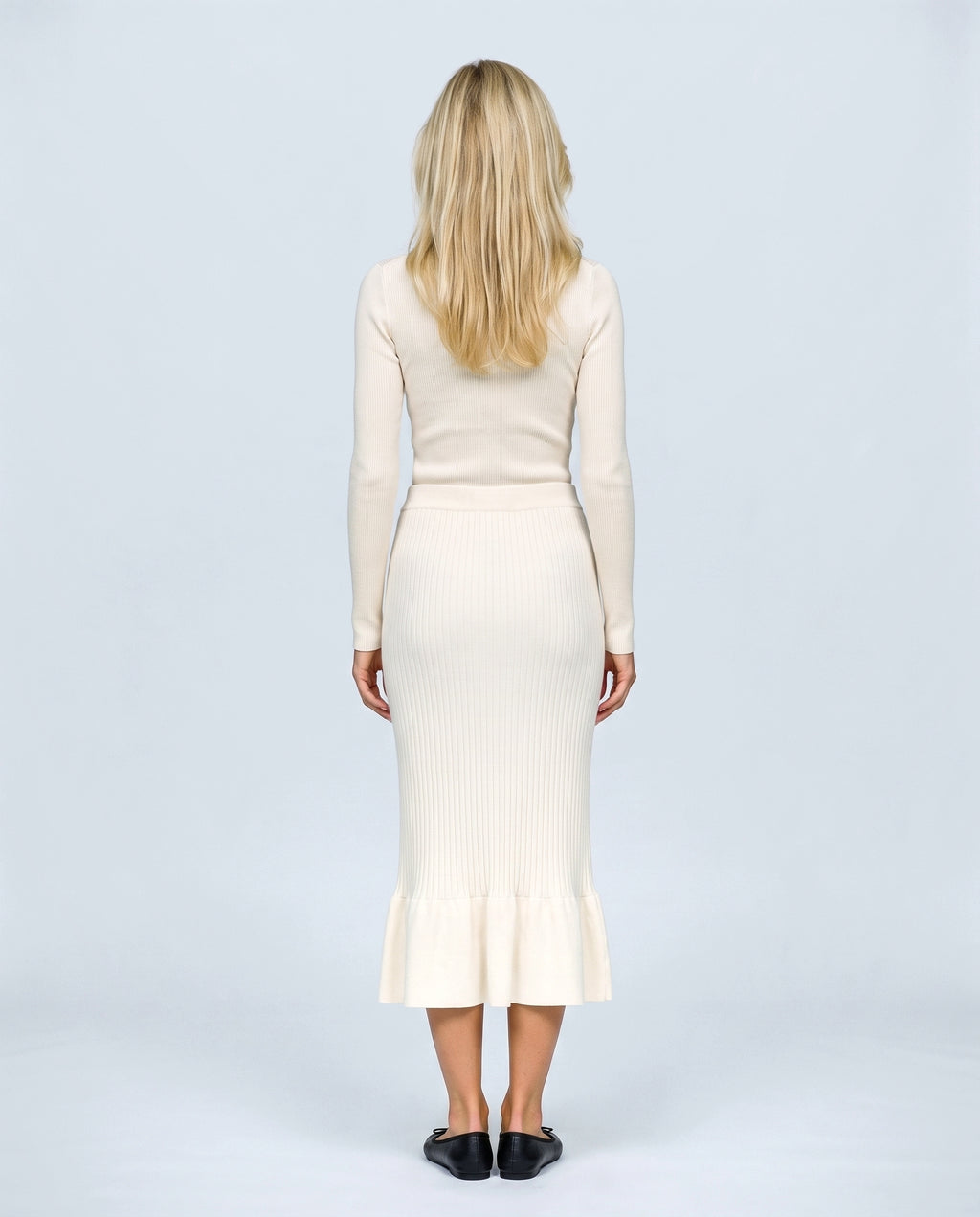 The Maternity Fluted Knit Skirt in Off-white, back view on a non-pregnant model