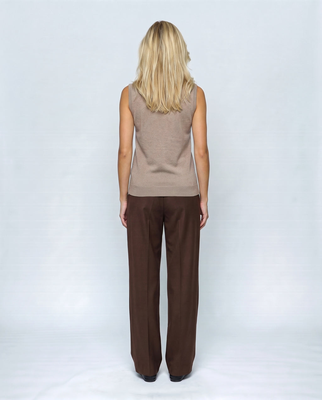 The Sleeveless Roll-Neck in Camel taupe, back view on a non-pregnant model